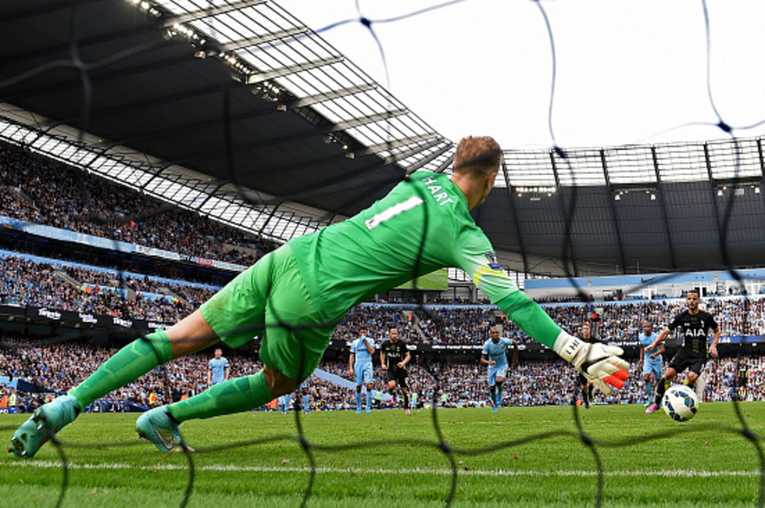 MANCHESTER, ENGLAND - OCTOBER 18:  Goalkeeper Joe Hart of Manchester City saves the penalty attempt from Roberto Soldado of Spurs during the Barclays Premier League match between Manchester City and Tottenham Hotspur at Etihad Stadium on October 18, 2014 