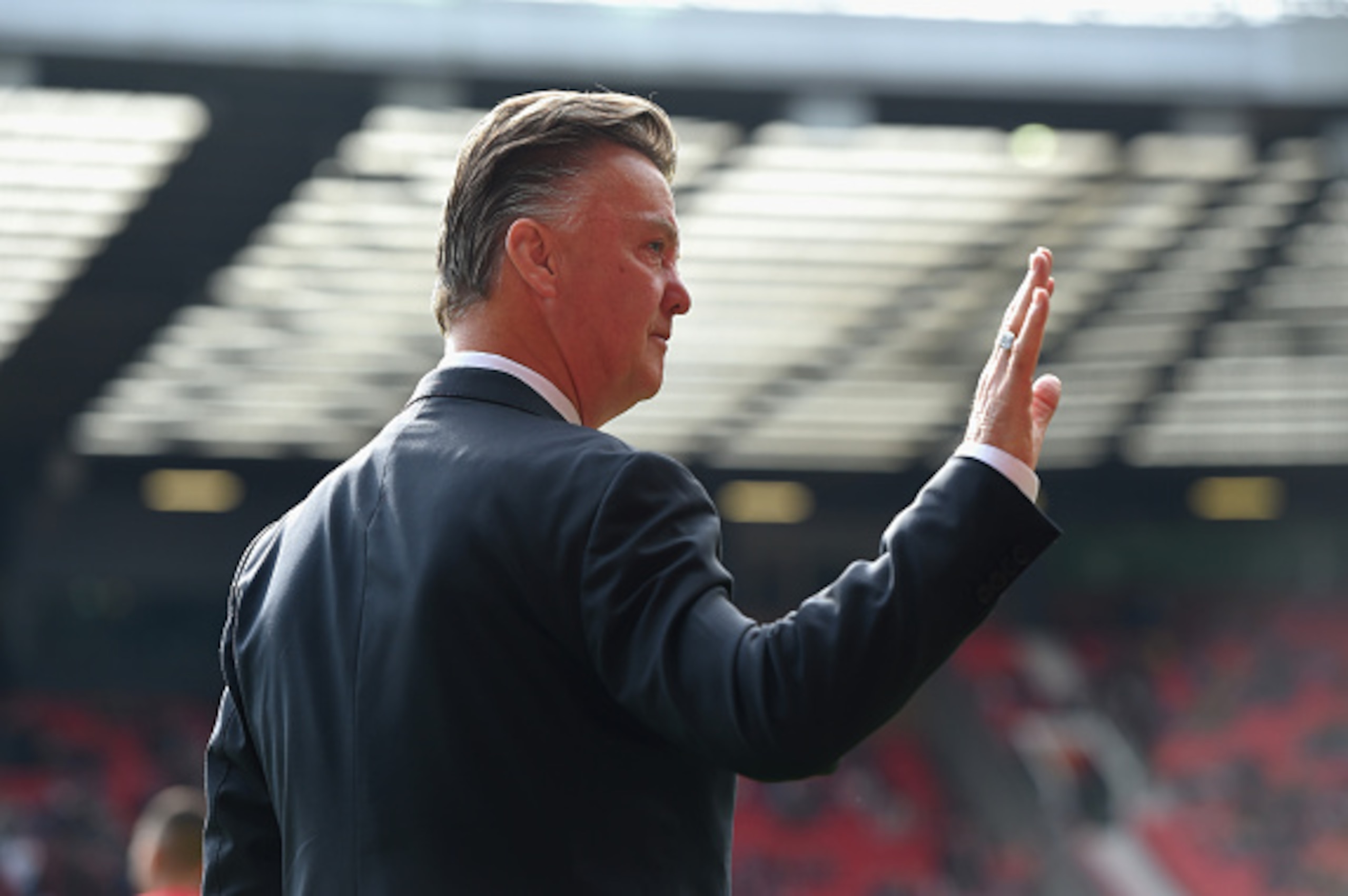 MANCHESTER, ENGLAND - OCTOBER 05:  Manchester United Manager Louis van Gaal waves to fans prior to the Barclays Premier League match between Manchester United and Everton at Old Trafford on October 5, 2014 in Manchester, England.  (Photo by Michael Regan/