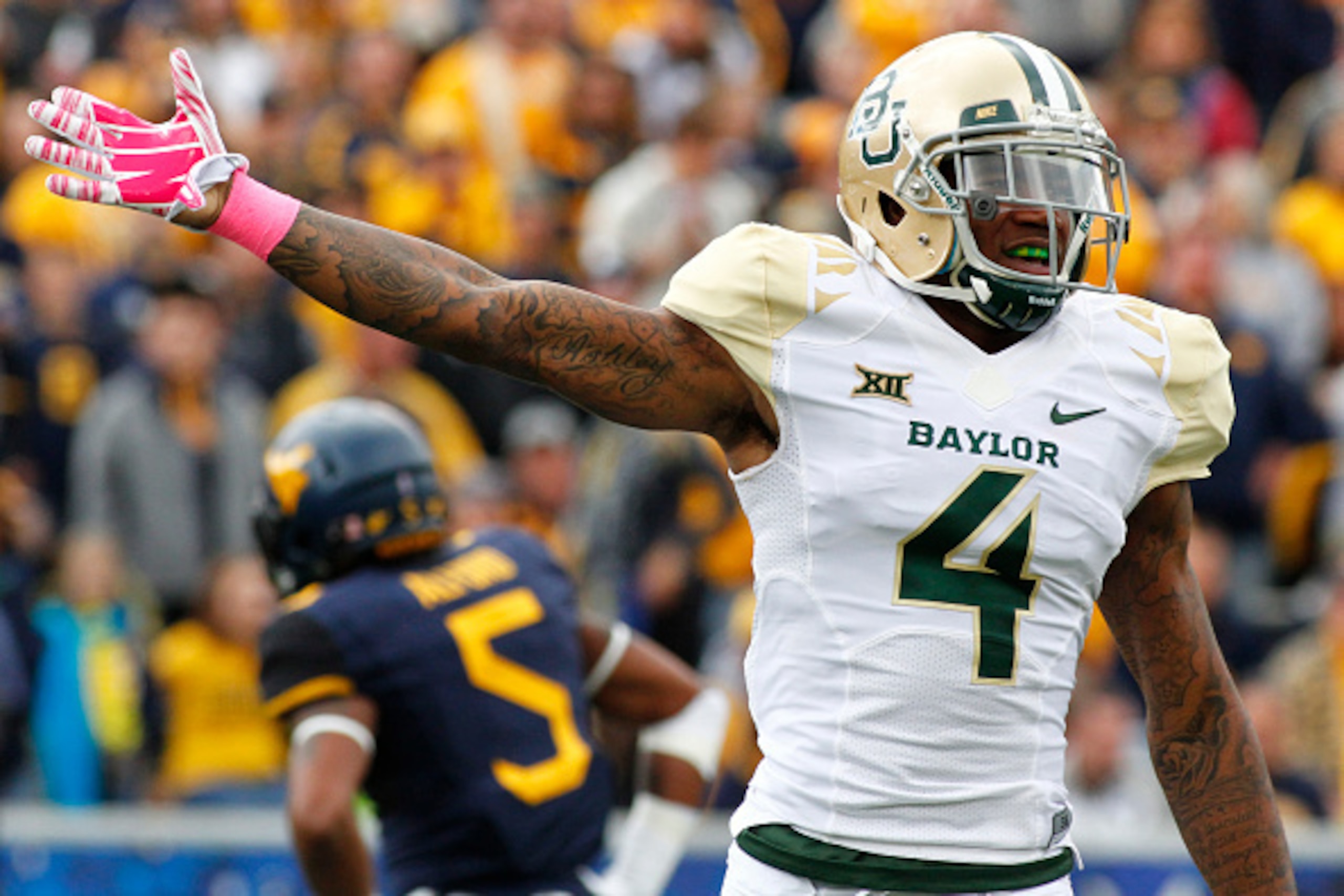 MORGANTOWN, WV - OCTOBER 18: Xavien Howard #4 of the Baylor Bears reacts after the Baylor Bears recovered a fumble in the first quarter against the West Virginia Mountaineers during the game on October 18, 2014 at Mountaineer Field in Morgantown, West Vi MORGANTOWN, WV - OCTOBER 18: Xavien Howard #4 of the Baylor Bears reacts after the Baylor Bears recovered a fumble in the first quarter against the West Virginia Mountaineers during the game on October 18, 2014 at Mountaineer Field in Morgantown, West Vi