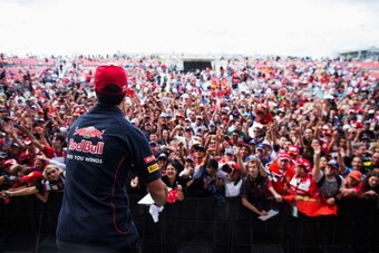 AUSTIN, TX - NOVEMBER 16:  Daniel Ricciardo of Australia and Scuderia Toro Rosso meets fans at the drivers autograph session following qualifying for the United States Formula One Grand Prix at Circuit of The Americas on November 16, 2013 in Austin, Unite