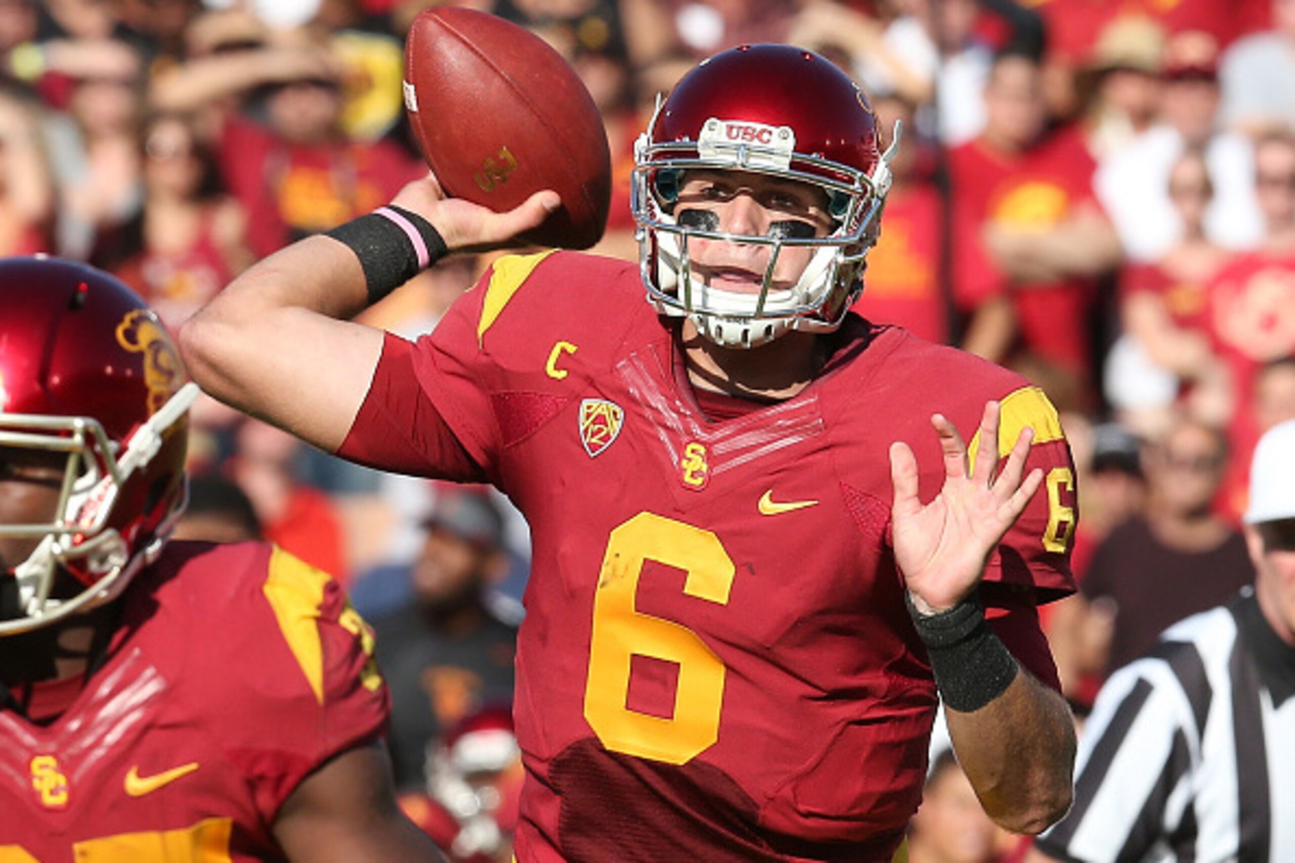 LOS ANGELES, CA - OCTOBER 18: Quarterback Cody Kessler #6 of the USC Trojans throws a seven yard touchdown pass the JuJu smith in the first uarter against the Colorado Buffaloes at Los Angeles Memorial Coliseum on October 18, 2014 in Los Angeles, Californ