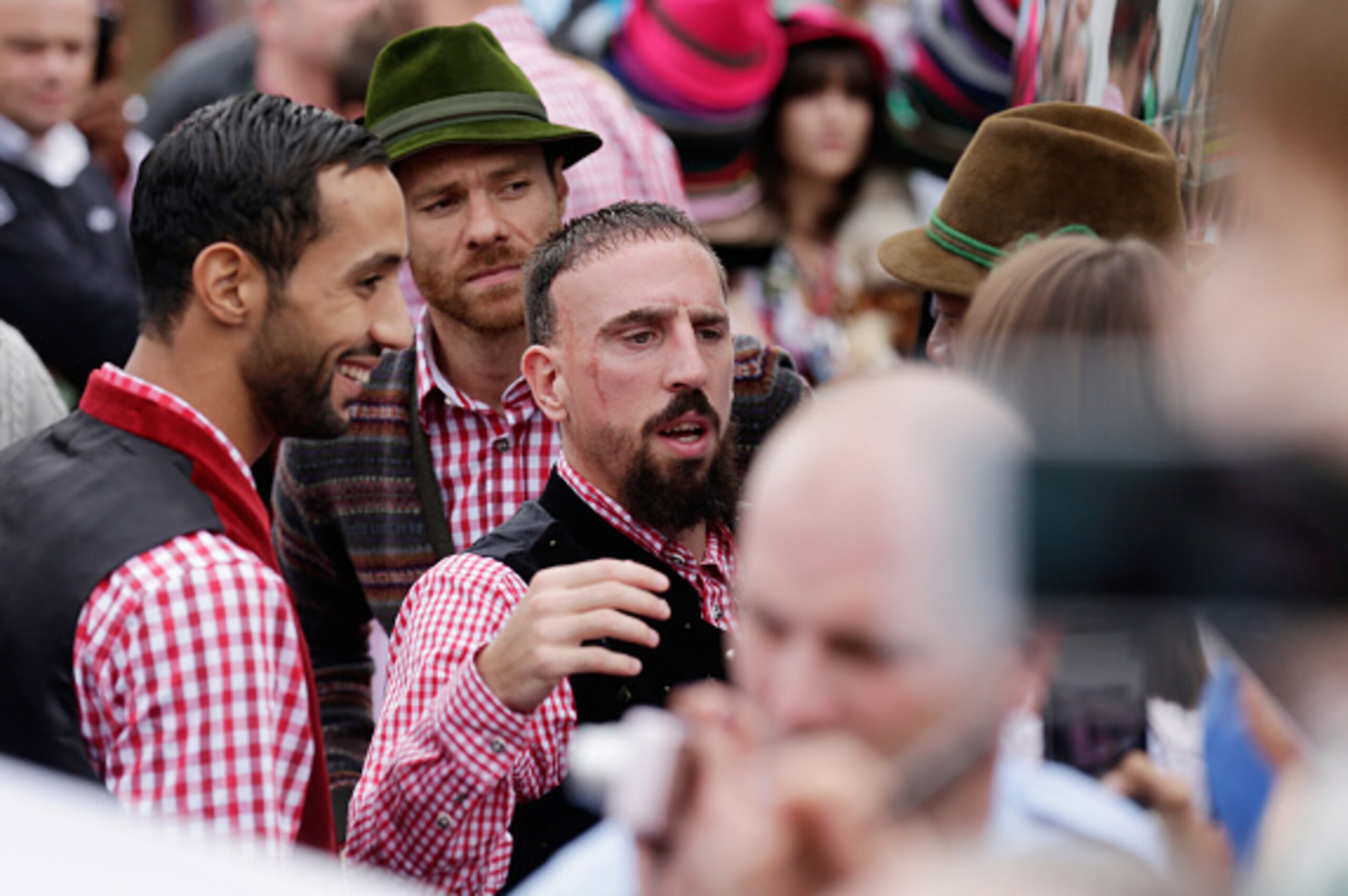 MUNICH, GERMANY - OCTOBER 05:  (L-R) Mehdi Benatia, Xabi Alonso and Franck Ribery football players of Bayern Muenchen arrive for the Oktoberfest beer festival at Kaefer Wiesnschaenke tent at Theresienwiese on October 5, 2014 in Munich, Germany  (Photo by 