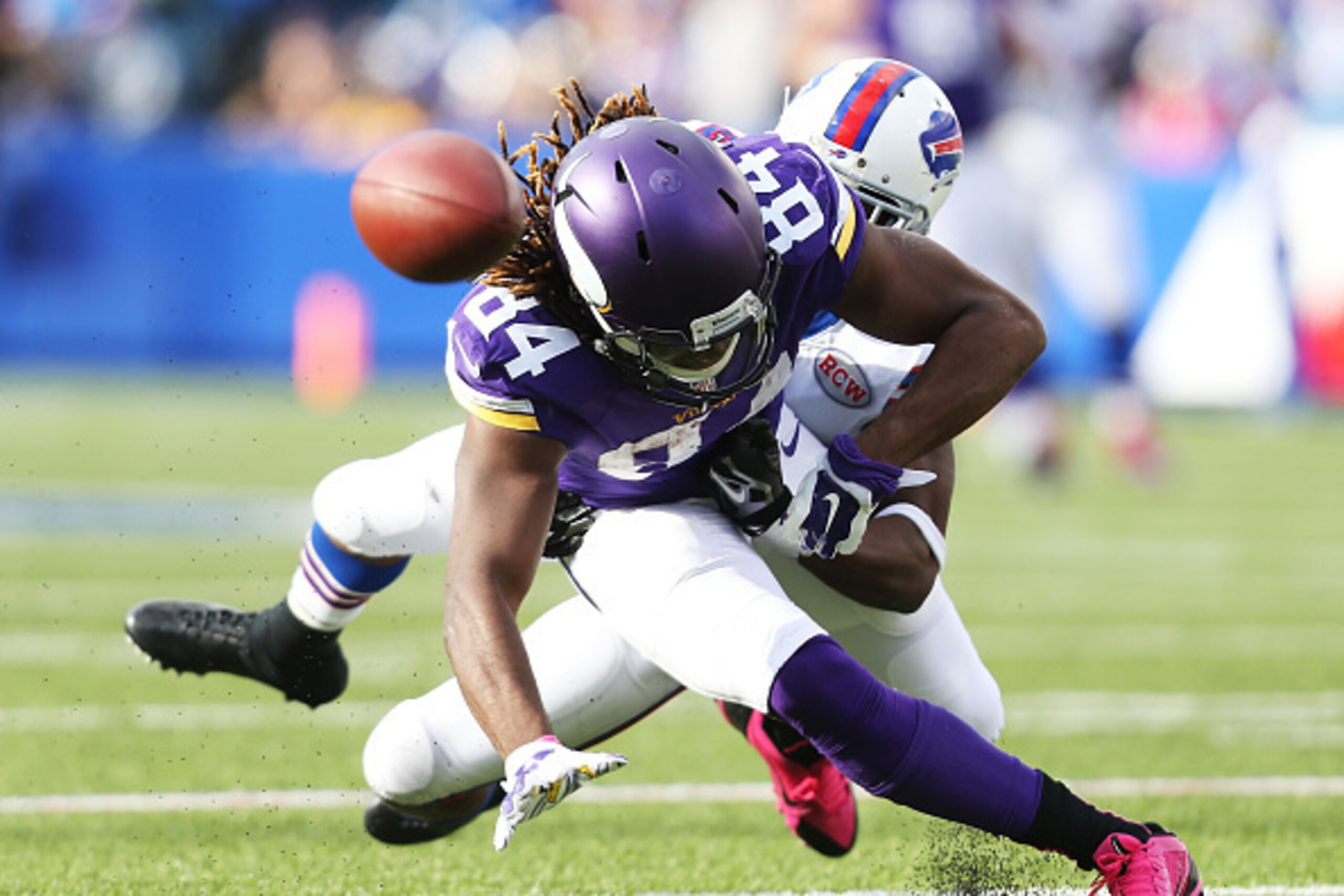 ORCHARD PARK, NY - OCTOBER 19:   Cordarrelle Patterson #84 of the Minnesota Vikings has the ball knocked away by Leodis McKelvin #21 of the Buffalo Bills during the second half at Ralph Wilson Stadium on October 19, 2014 in Orchard Park, New York.  (Photo
