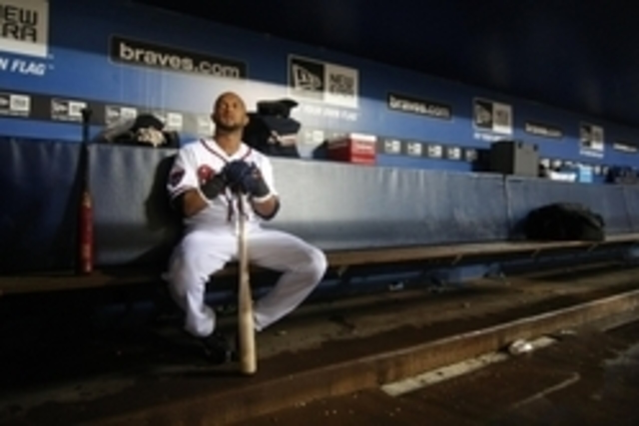 Aug 8, 2014; Atlanta, GA, USA; Atlanta Braves infielder Emilio Bonifacio (1) sits in the dugout during a rain delay against the Washington Nationals in the sixth inning at Turner Field. Mandatory Credit: Brett Davis-USA TODAY Sports