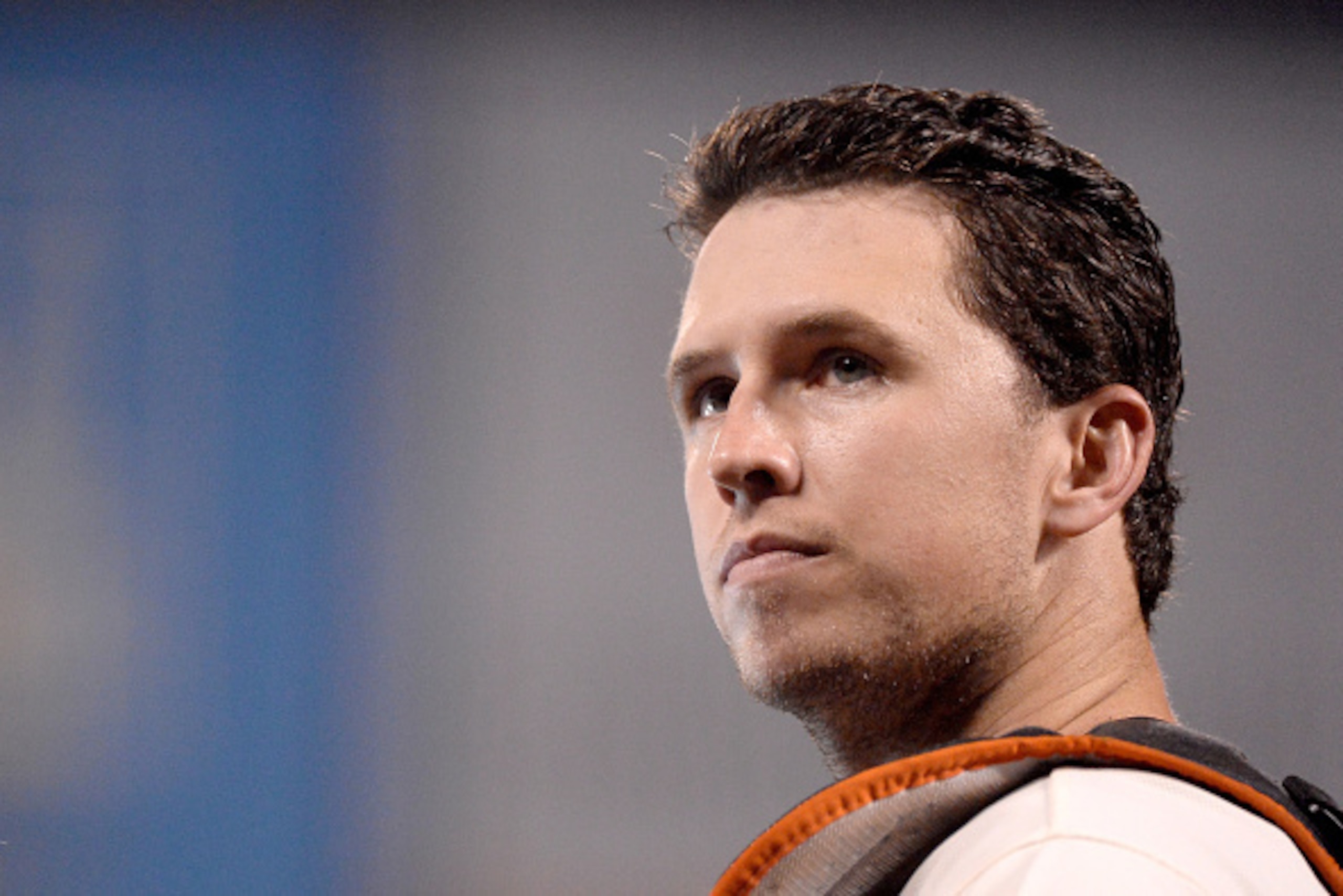 SAN FRANCISCO, CA - OCTOBER 15:  Buster Posey #28 of the San Francisco Giants looks on after the Giants defeat the St. Louis Cardinals 6-4 during Game Four of the National League Championship Series at AT&T Park on October 15, 2014 in San Francisco, Calif