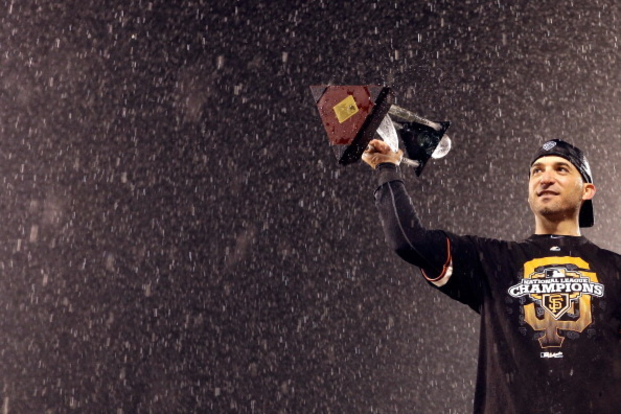 SAN FRANCISCO, CA - OCTOBER 22:  Marco Scutaro #19 of the San Francisco Giants holds up the MVP trophy after the Giants defeat the St. Louis Cardinals 9-0 in Game Seven of the National League Championship Series at AT&T Park on October 22, 2012 in San Fra