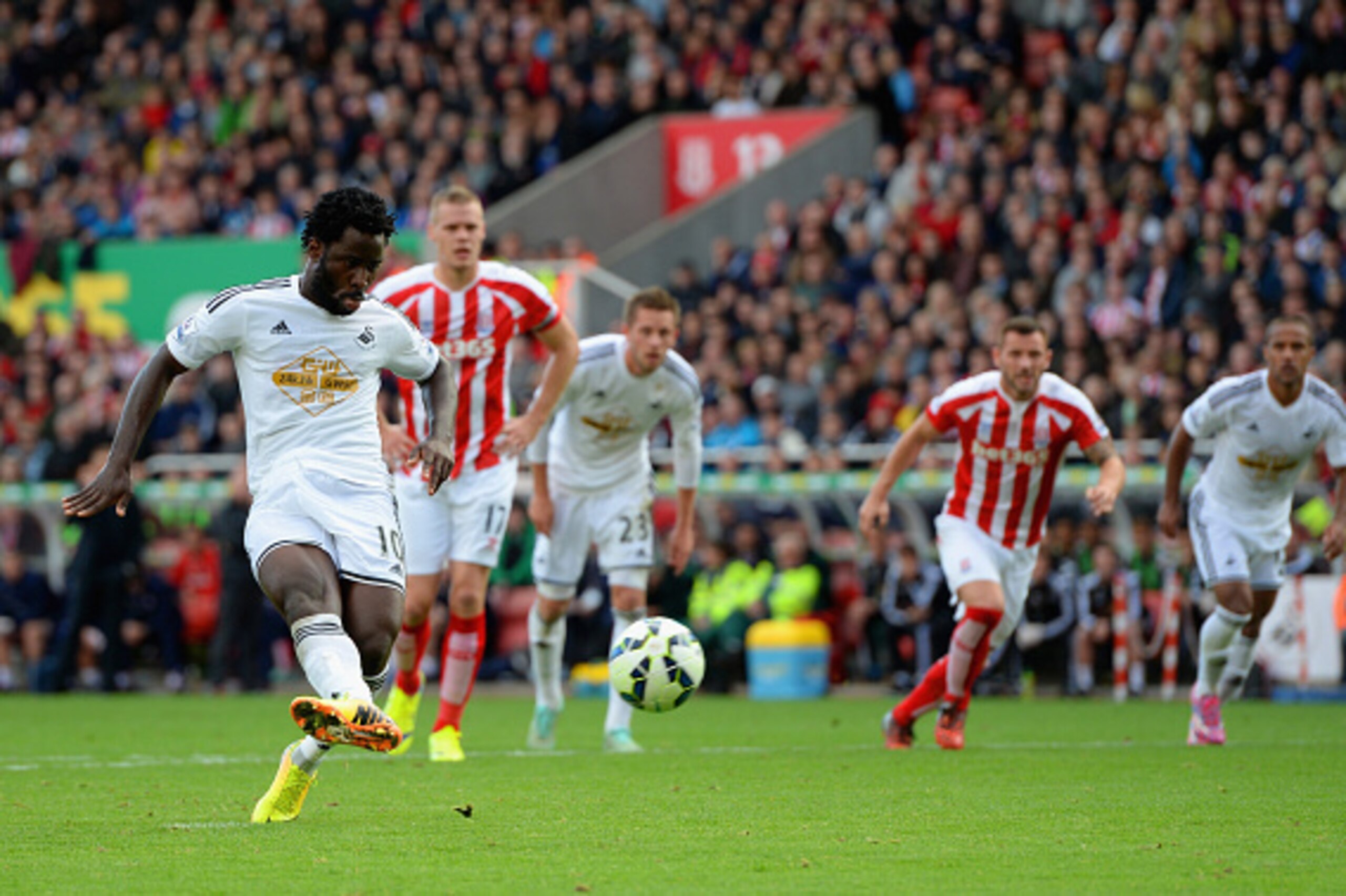 STOKE ON TRENT, ENGLAND - OCTOBER 19:  Wilfried Bony of Swansea City scores the first goal from the penalty spot during the Barclays Premier League match between Stoke City and Swansea City at Britannia Stadium on October 19, 2014 in Stoke on Trent, Engla