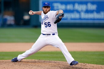 KANSAS CITY, MO - OCTOBER 15:  Greg Holland #56 of the Kansas City Royals throws a pitch in the ninth inning against the Baltimore Orioles during Game Four of the American League Championship Series at Kauffman Stadium on October 15, 2014 in Kansas City, 