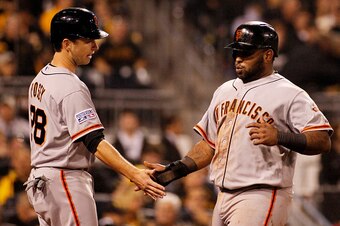 PITTSBURGH, PA - OCTOBER 01:  Pablo Sandoval #48 celebrates with Buster Posey #28 of the San Francisco Giants after scoring on a single by Brandon Belt #9 in the seventh inning against the Pittsburgh Pirates during the National League Wild Card game at PN