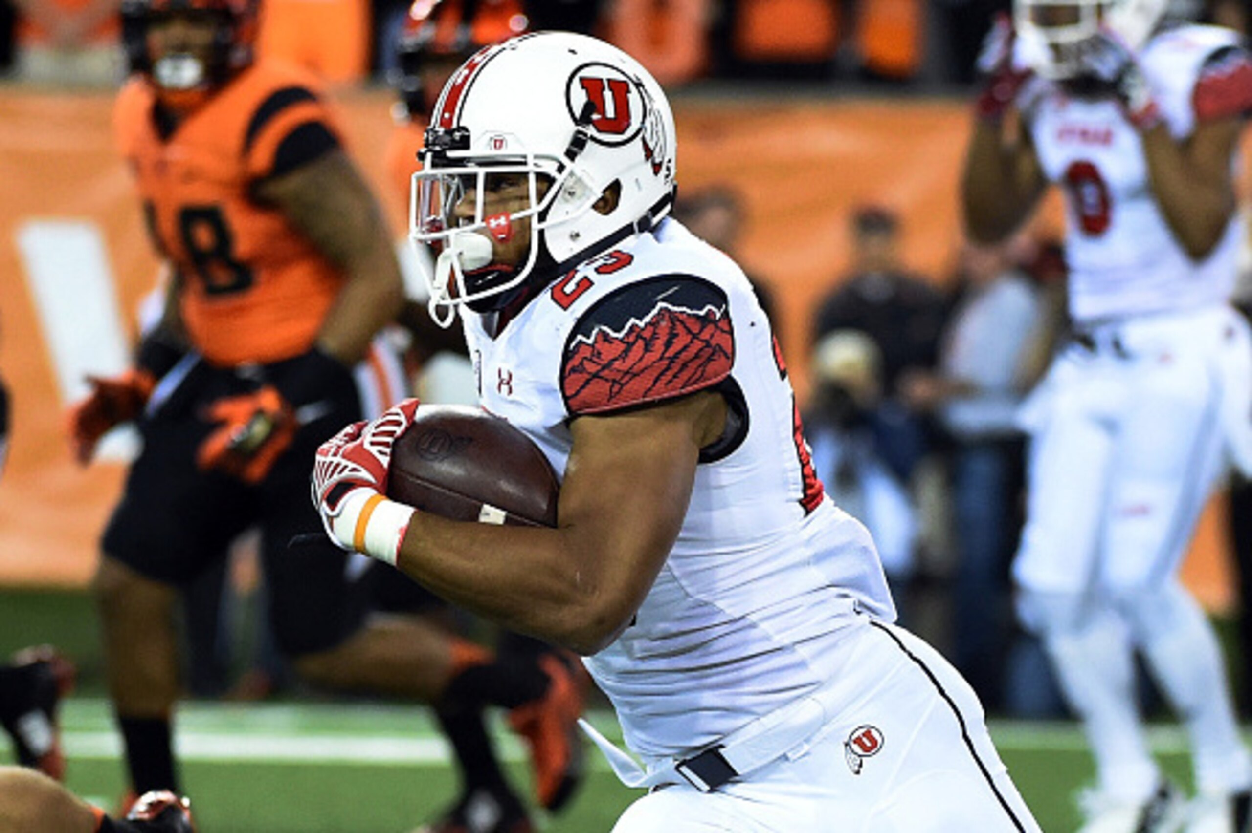 CORVALLIS, OR - OCTOBER 16: Running back Devontae Booker #23 of the Utah Utes runs with the ball during the first quarter of the game against the Oregon State Beavers at Reser Stadium on October 16, 2014 in Corvallis, Oregon.  (Photo by Steve Dykes/Getty