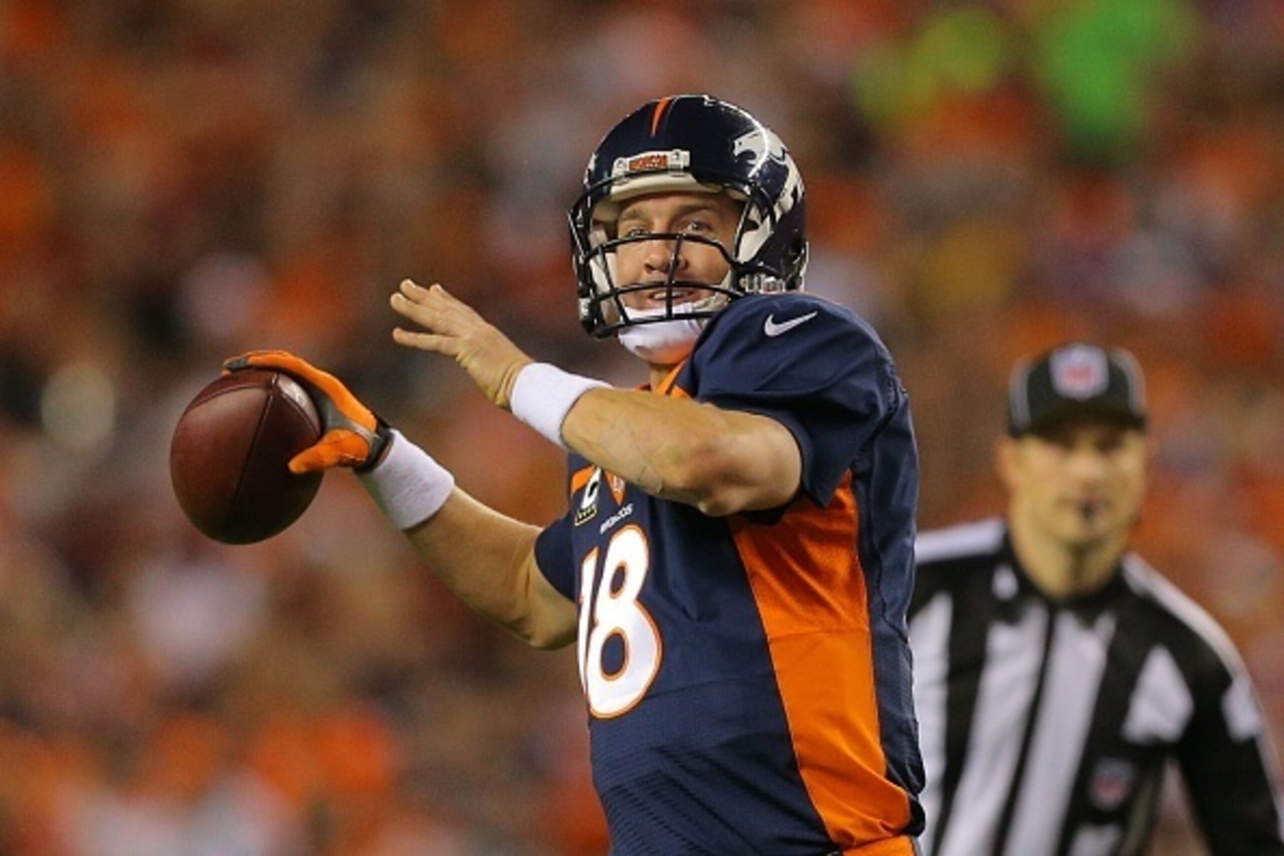 DENVER, CO - OCTOBER 19: Quarterback Peyton Manning #18 of the Denver Broncos throws a pass against the San Francisco 49ers during the second quarter of a game at Sports Authority Field at Mile High on October 19, 2014 in Denver, Colorado. (Photo by Jus DENVER, CO - OCTOBER 19: Quarterback Peyton Manning #18 of the Denver Broncos throws a pass against the San Francisco 49ers during the second quarter of a game at Sports Authority Field at Mile High on October 19, 2014 in Denver, Colorado. (Photo by Jus