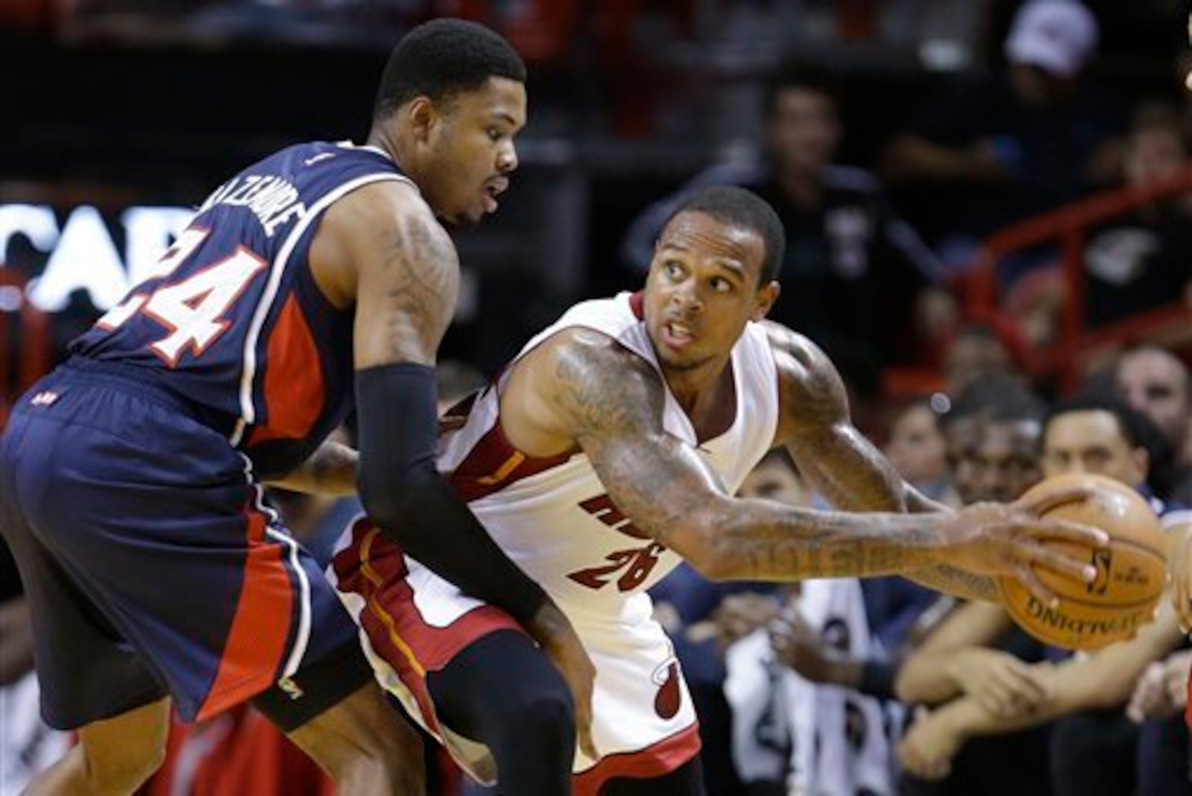 Bazemore (left) knows how to make opponents work with his defense. Bazemore (left) knows how to make opponents work with his defense.