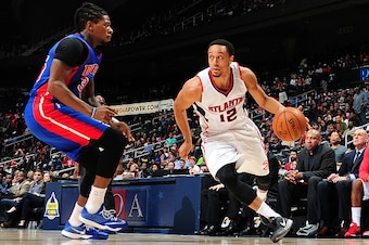 ATLANTA, GA - OCTOBER 18: John Jenkins #12 of the Atlanta Hawks drives against the Detroit Pistons on October 18, 2014 at Philips Arena in Atlanta, Georgia.  NOTE TO USER: User expressly acknowledges and agrees that, by downloading and/or using this Photo