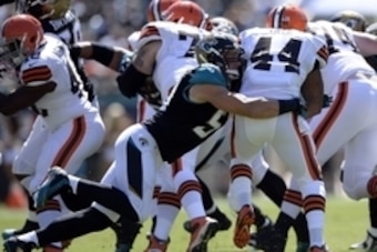 Oct 19, 2014; Jacksonville, FL, USA; Jacksonville Jaguars middle linebacker Paul Posluszny (51) tackles Cleveland Browns running back Ben Tate (44) during the first quarter at EverBank Field. Mandatory Credit: Richard Dole-USA TODAY Sports