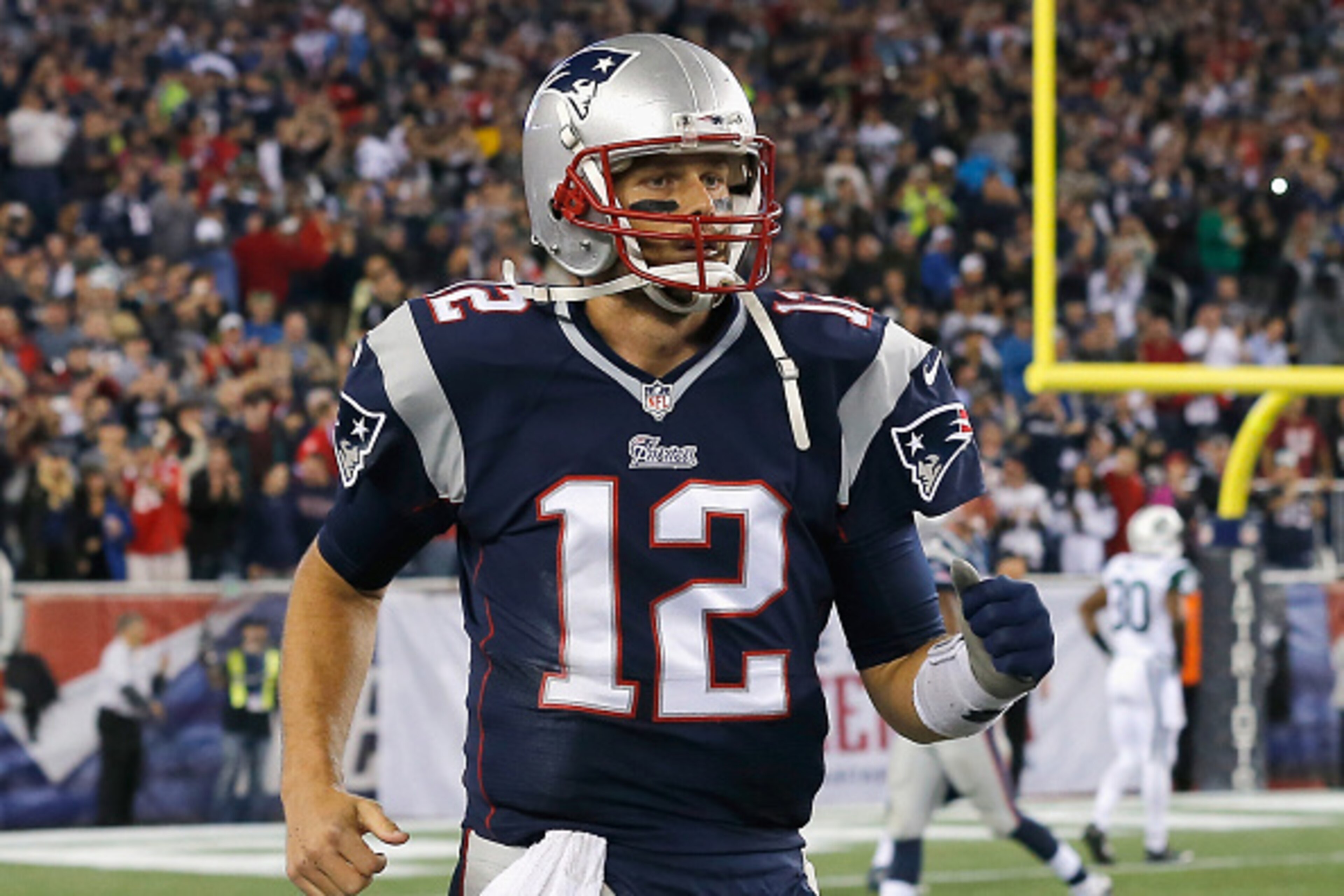 FOXBORO, MA - OCTOBER 16: Tom Brady #12 of the New England Patriots reacts after throwing a touchdown pass during the fourth quarter against the New York Jets at Gillette Stadium on October 16, 2014 in Foxboro, Massachusetts. (Photo by Jim Rogash/Getty FOXBORO, MA - OCTOBER 16: Tom Brady #12 of the New England Patriots reacts after throwing a touchdown pass during the fourth quarter against the New York Jets at Gillette Stadium on October 16, 2014 in Foxboro, Massachusetts. (Photo by Jim Rogash/Getty