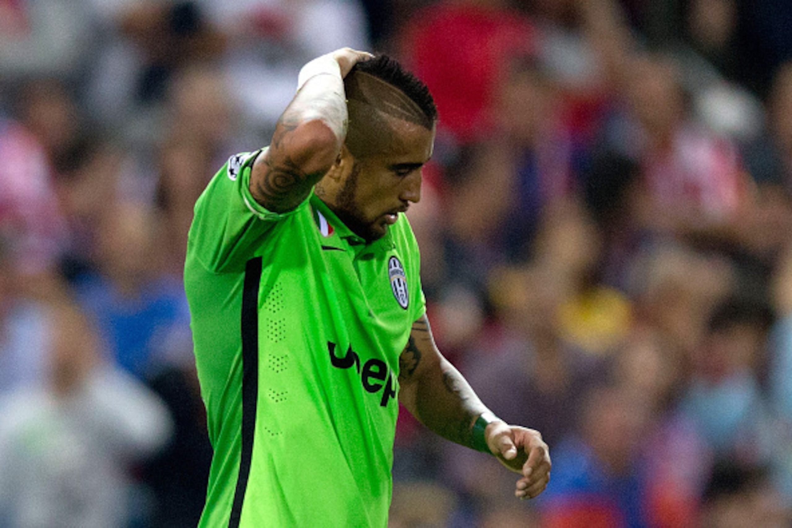MADRID, SPAIN - OCTOBER 01: Arturo Vidal of Juventus reacts during the UEFA Champions League group A match between Club Atletico de Madrid and Juventus at Vievnte Calderon Stadium on October 1, 2014 in Madrid, Spain.  (Photo by Gonzalo Arroyo Moreno/Getty