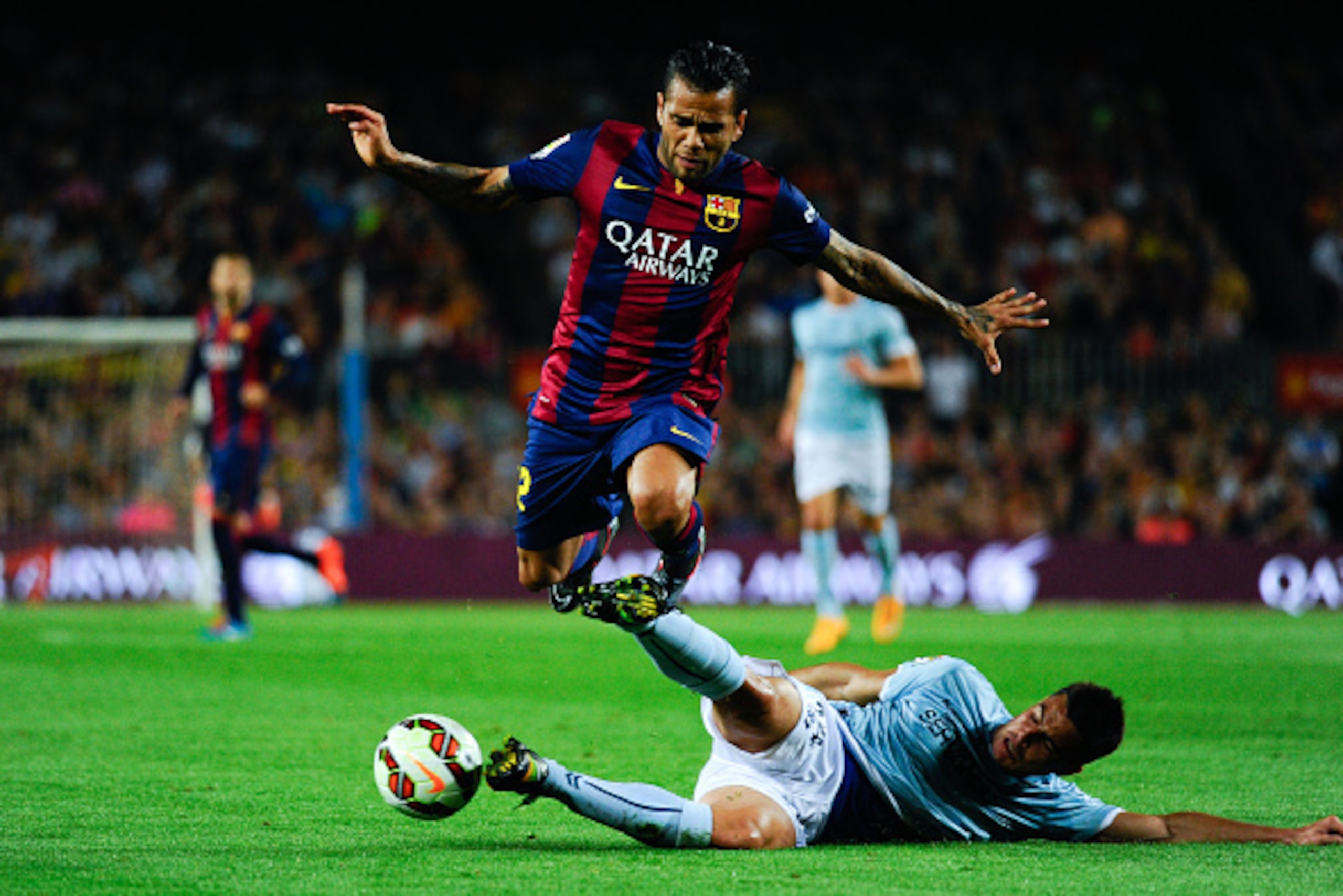 BARCELONA, SPAIN - OCTOBER 18: Dani Alves of FC Barcelona duels for the ball with Dani Garcia of SD Eibar during the La Liga match between FC Barcelona and SD Eibar at Camp Nou on October 18, 2014 in Barcelona, Spain.  (Photo by Sandra Montanez/Getty Imag