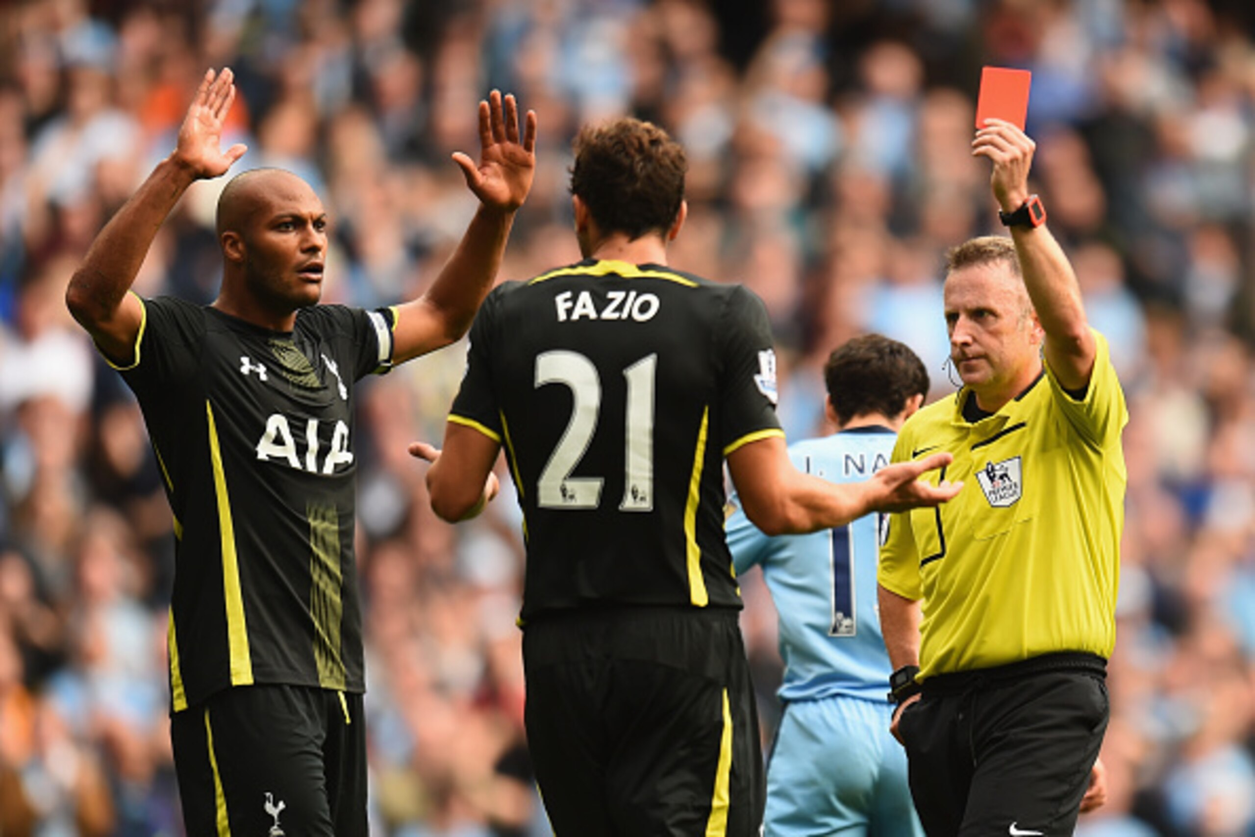 MANCHESTER, ENGLAND - OCTOBER 18:  Referee Jonathan Moss sends off Federico Fazio of Tottenham Hotspur during the Barclays Premier League match between Manchester City and Tottenham Hotspur at Etihad Stadium on October 18, 2014 in Manchester, England.  (P