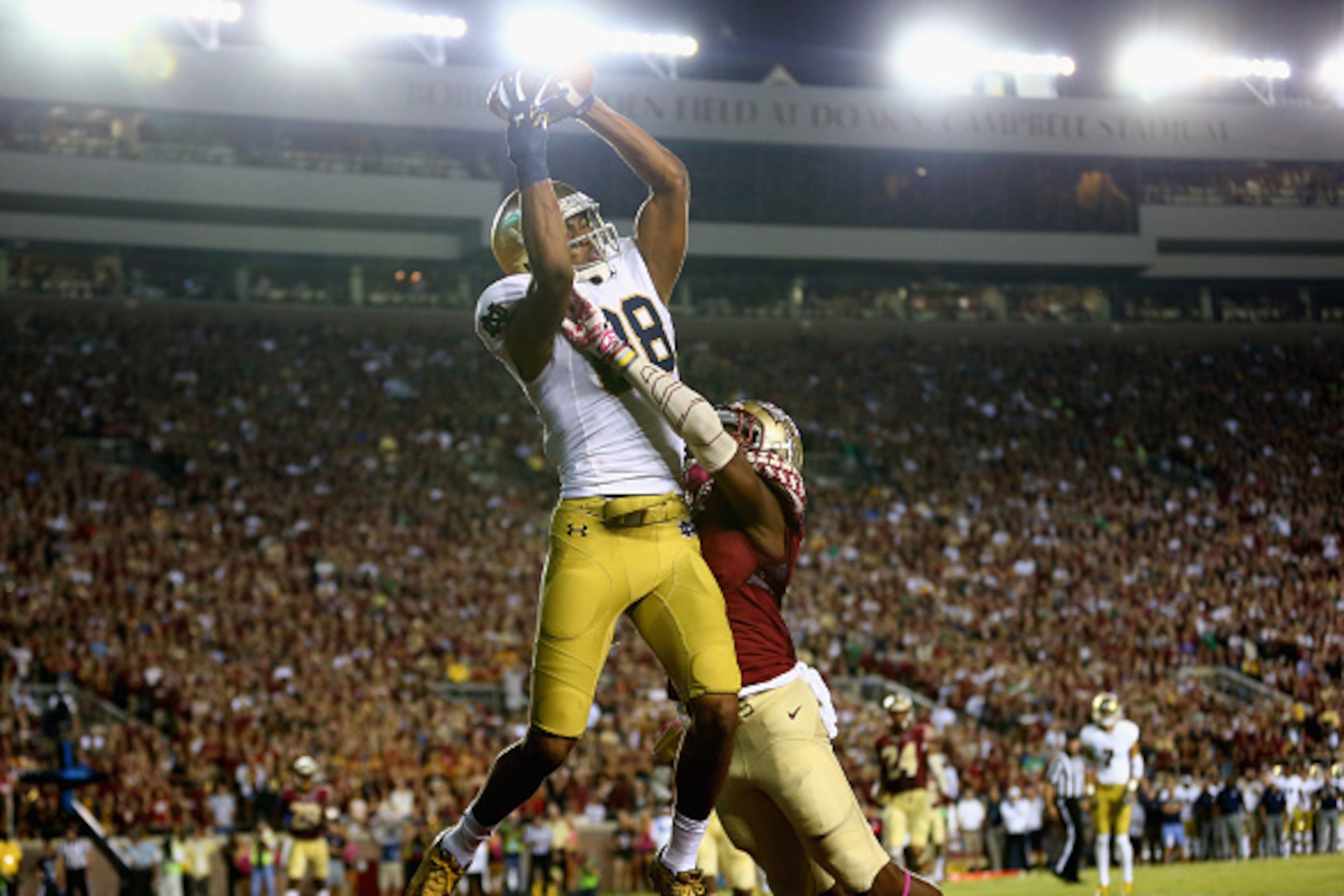 TALLAHASSEE, FL - OCTOBER 18:  Corey Robinson #88 of the Notre Dame Fighting Irish catches a touchdown over Jalen Ramsey #8 of the Florida State Seminoles during their game at Doak Campbell Stadium on October 18, 2014 in Tallahassee, Florida.  (Photo by S