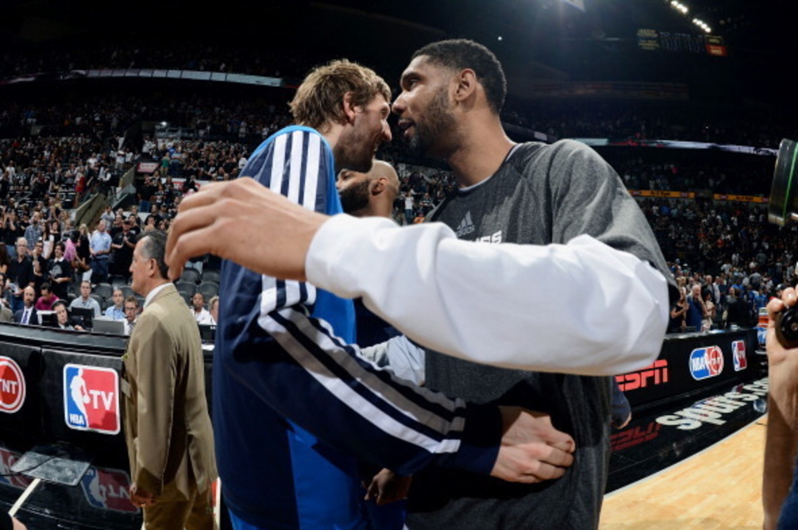 SAN ANTONIO, TX - MAY 5: Dirk Nowitzki #41 of the Dallas Mavericks hugs Tim Duncan #21 of the San Antonio Spurs in Game Seven of the Western Conference Quarterfinals during the 2014 NBA Playoffs on May 5, 2014 at the AT&T Center in San Antonio, Texas. NOT