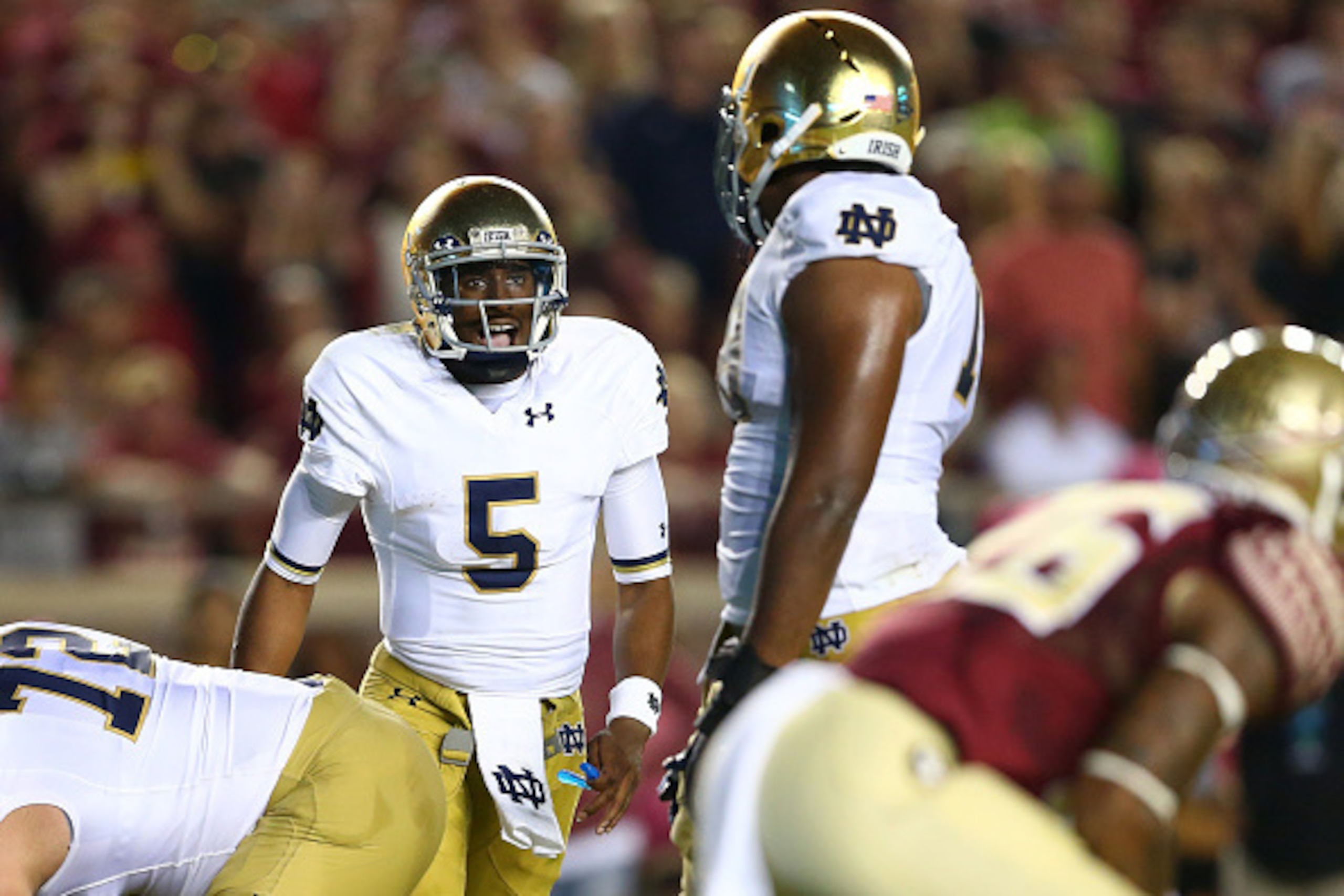 TALLAHASSEE, FL - OCTOBER 18:  Everett Golson #5 of the Notre Dame Fighting Irish yells to his teammates against the Florida State Seminoles during their game at Doak Campbell Stadium on October 18, 2014 in Tallahassee, Florida.  (Photo by Streeter Lecka/