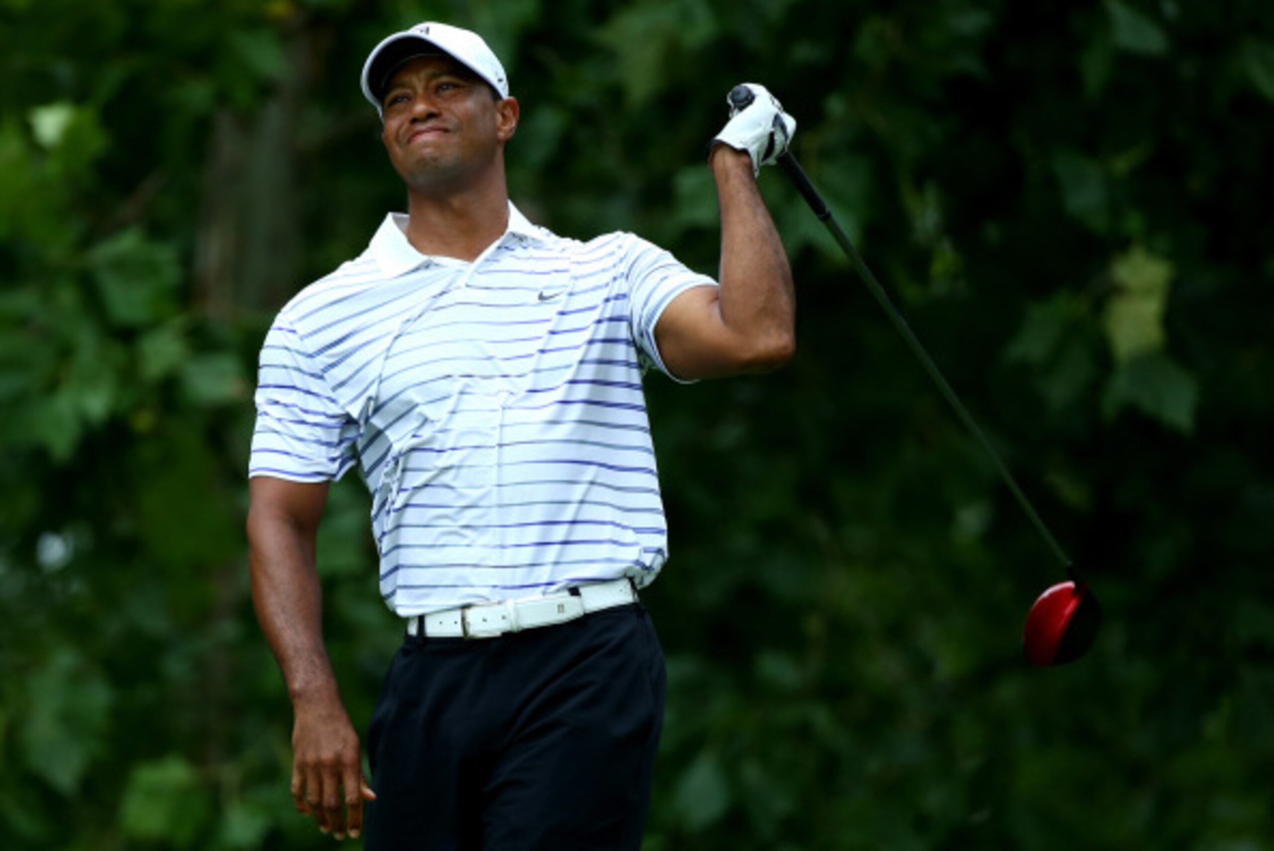 LOUISVILLE, KY - AUGUST 08:  Tiger Woods of the United States reacts on the seventh tee during the second round of the 96th PGA Championship at Valhalla Golf Club on August 8, 2014 in Louisville, Kentucky.  (Photo by Andy Lyons/Getty Images)