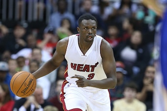 KANSAS CITY, MO - OCTOBER 17: Luol Deng #9 of the Miami Heat handles the ball against the Golden State Warriors during a game on October 17, 2014 at Sprint Center in Kansas City, Missouri. NOTE TO USER:  User expressly acknowledges and agrees that, by dow