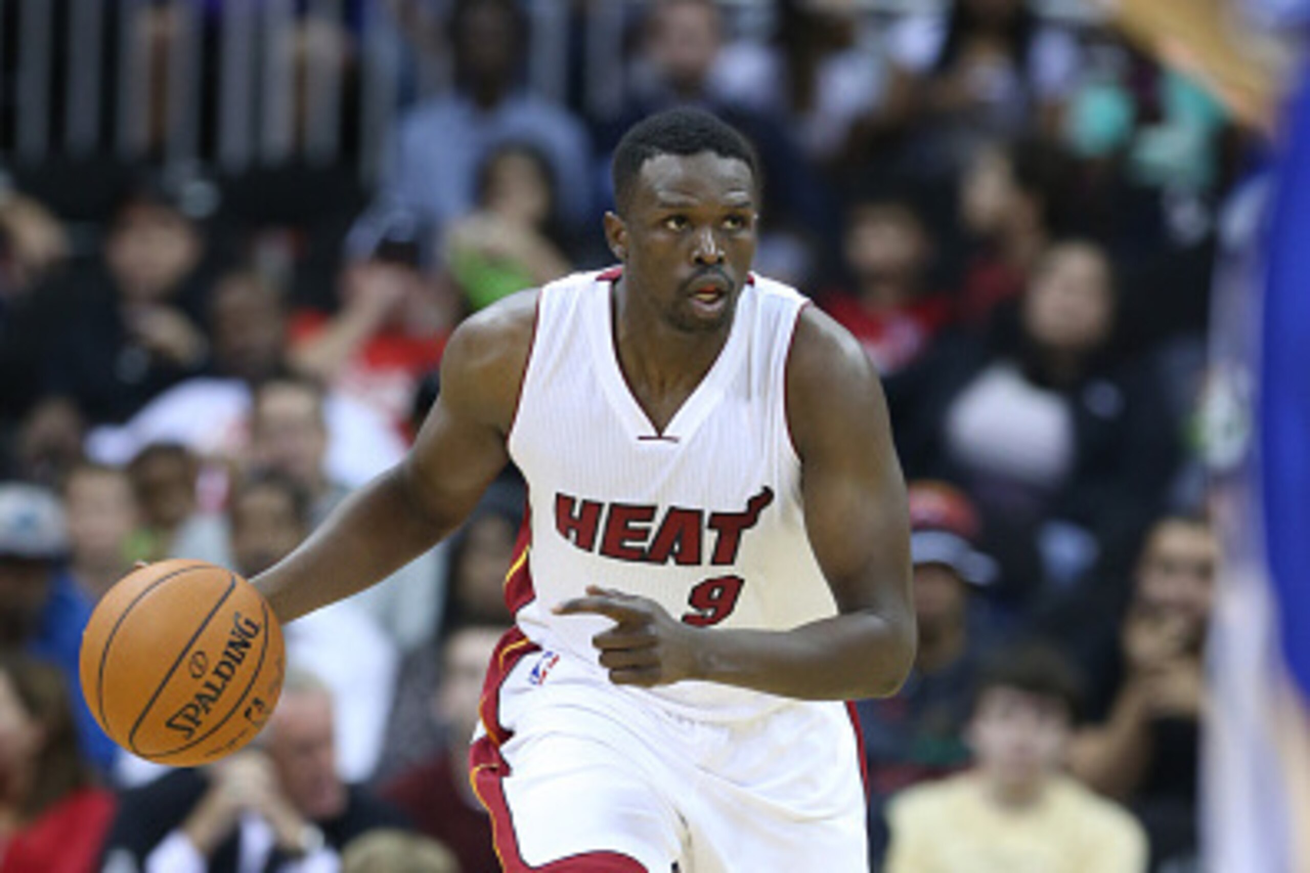 KANSAS CITY, MO - OCTOBER 17: Luol Deng #9 of the Miami Heat handles the ball against the Golden State Warriors during a game on October 17, 2014 at Sprint Center in Kansas City, Missouri. NOTE TO USER:  User expressly acknowledges and agrees that, by dow