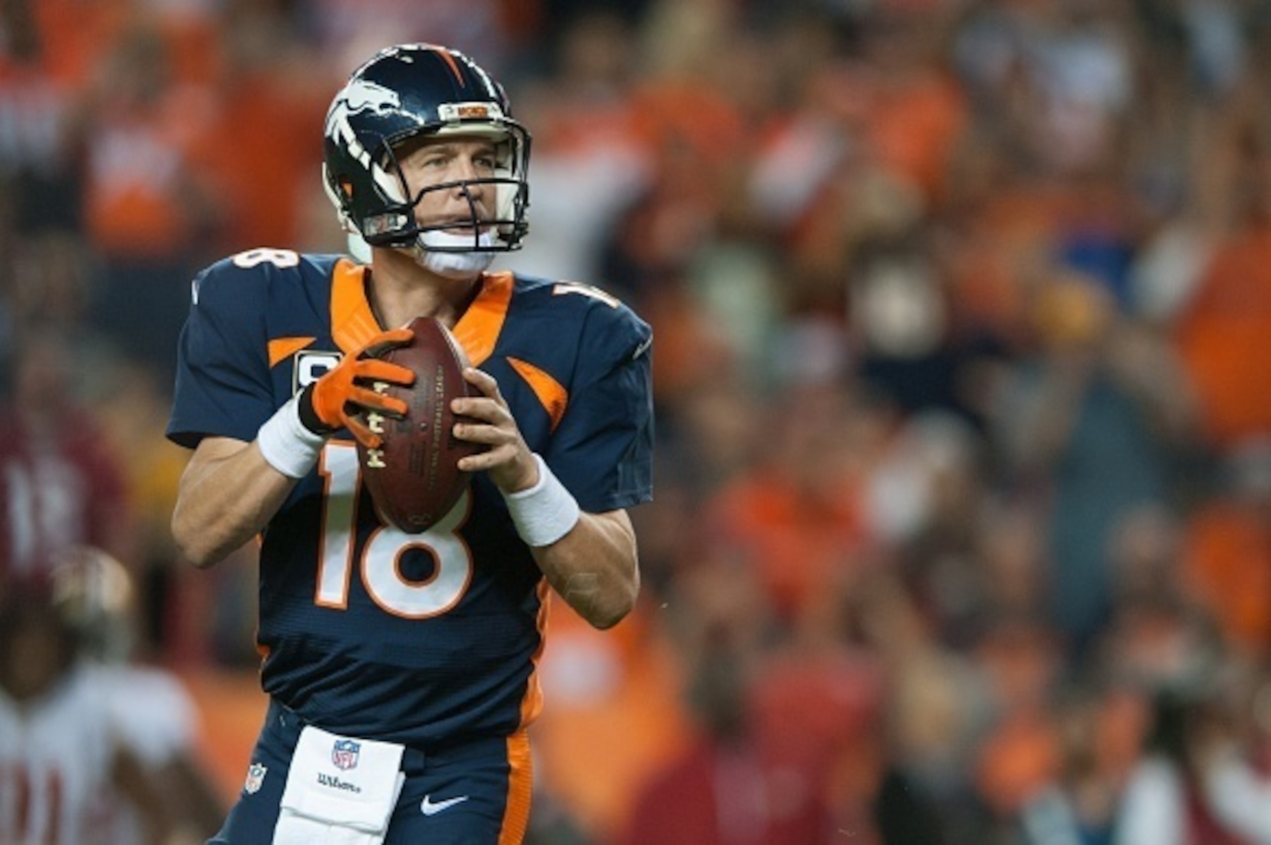 DENVER, CO - OCTOBER 19: Quarterback Peyton Manning #18 of the Denver Broncos drops back to throw on what would be his 509th career touchdown pass in the second quarter of a game against the San Francisco 49ers at Sports Authority Field at Mile High on O DENVER, CO - OCTOBER 19: Quarterback Peyton Manning #18 of the Denver Broncos drops back to throw on what would be his 509th career touchdown pass in the second quarter of a game against the San Francisco 49ers at Sports Authority Field at Mile High on O