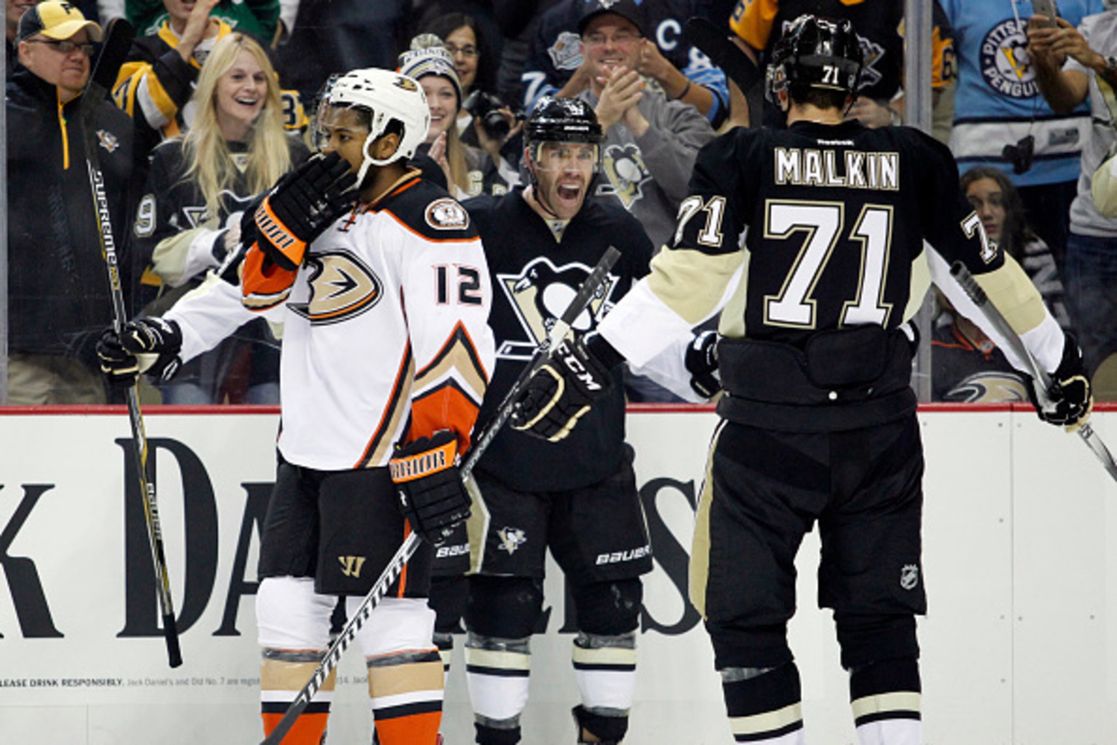 PITTSBURGH, PA - OCTOBER 09:  Pascal Dupuis #9 of the Pittsburgh Penguins celebrates his first period goal with Evgeni Malkin #71 against the Anaheim Ducks during the season opener at Consol Energy Center on October 9, 2014 in Pittsburgh, Pennsylvania.  (