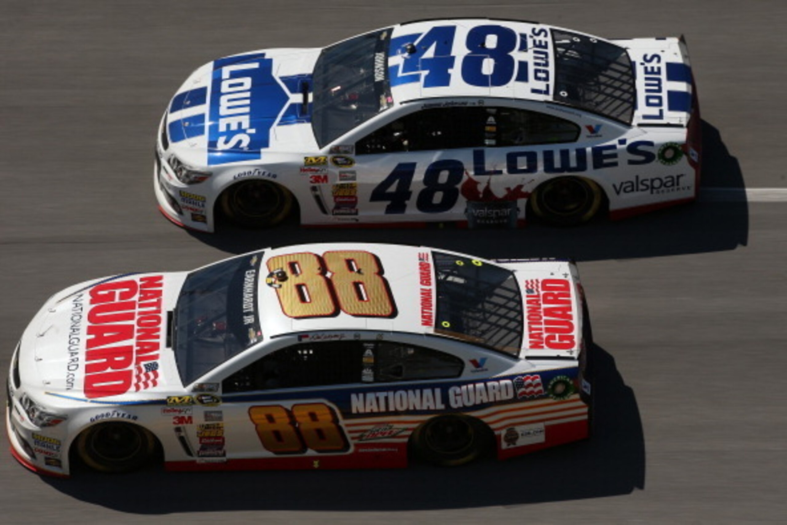 TALLADEGA, AL - MAY 04: Dale Earnhardt Jr., driver of the #88 National Guard Chevrolet, leads Jimmie Johnson, driver of the #48 Lowe's / Valspar Reserve Chevrolet, during the NASCAR Sprint Cup Series Aaron's 499 at Talladega Superspeedway on May 4, 2014 i