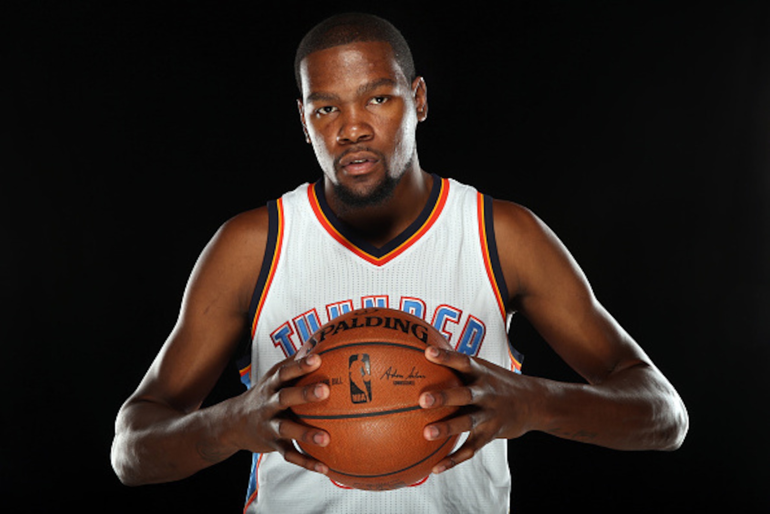 OKLAHOMA CITY, OK - SEPTEMBER 29:  Oklahoma City Thunder Kevin Durant #35 poses for a portrait during 2014 NBA Media Day on September 29, 2014 at the Thunder Events Center in Edmond, Oklahoma. NOTE TO USER: User expressly acknowledges and agrees that, by 