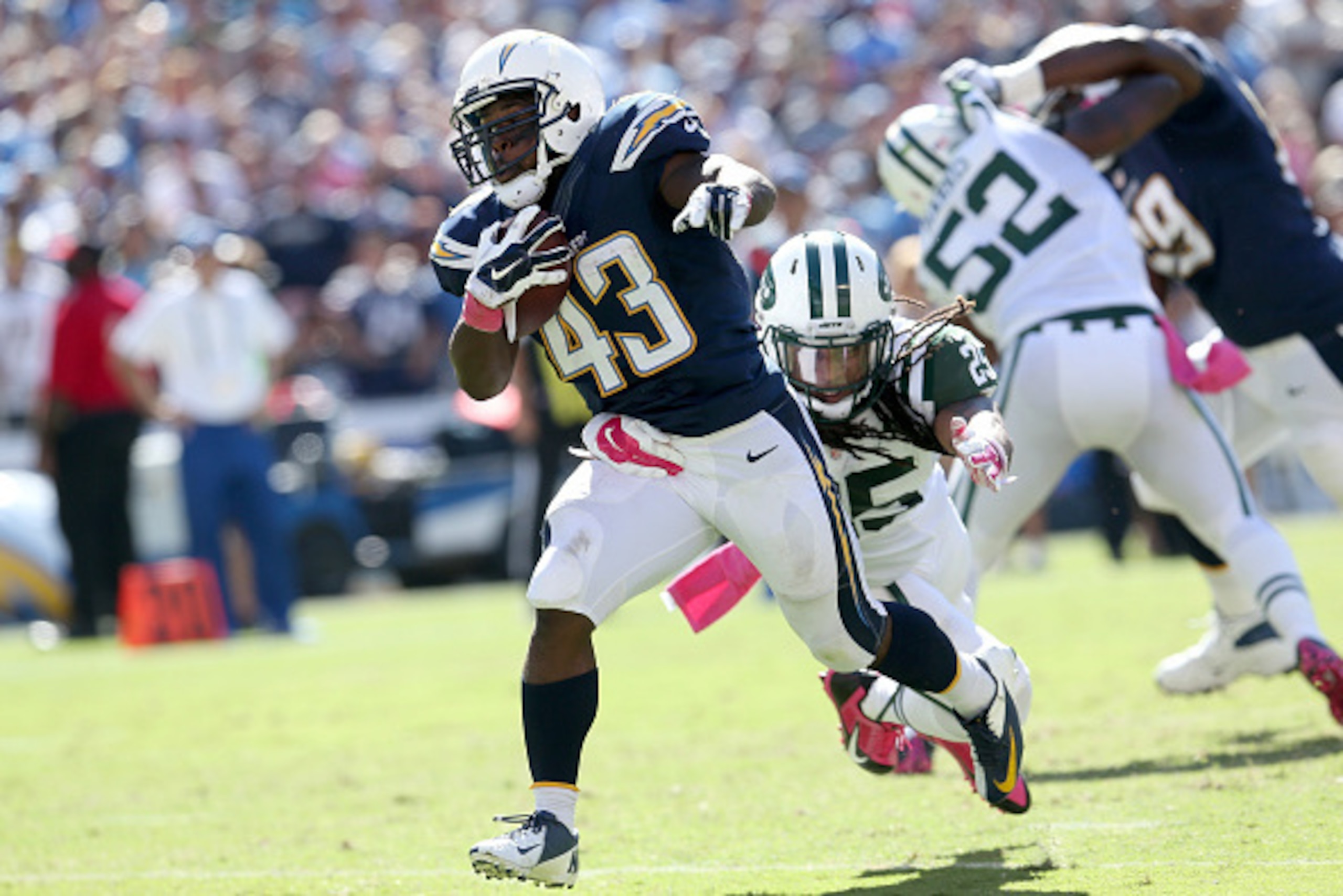 SAN DIEGO, CA - OCTOBER 05:  Running back Branden Oliver #43 of the San Diego Chargers carries the ball past safety Calvin Pryor #25 of the New York Jets on a 15 yard touchdown run in the second quarter at Qualcomm Stadium on October 5, 2014 in San Diego,