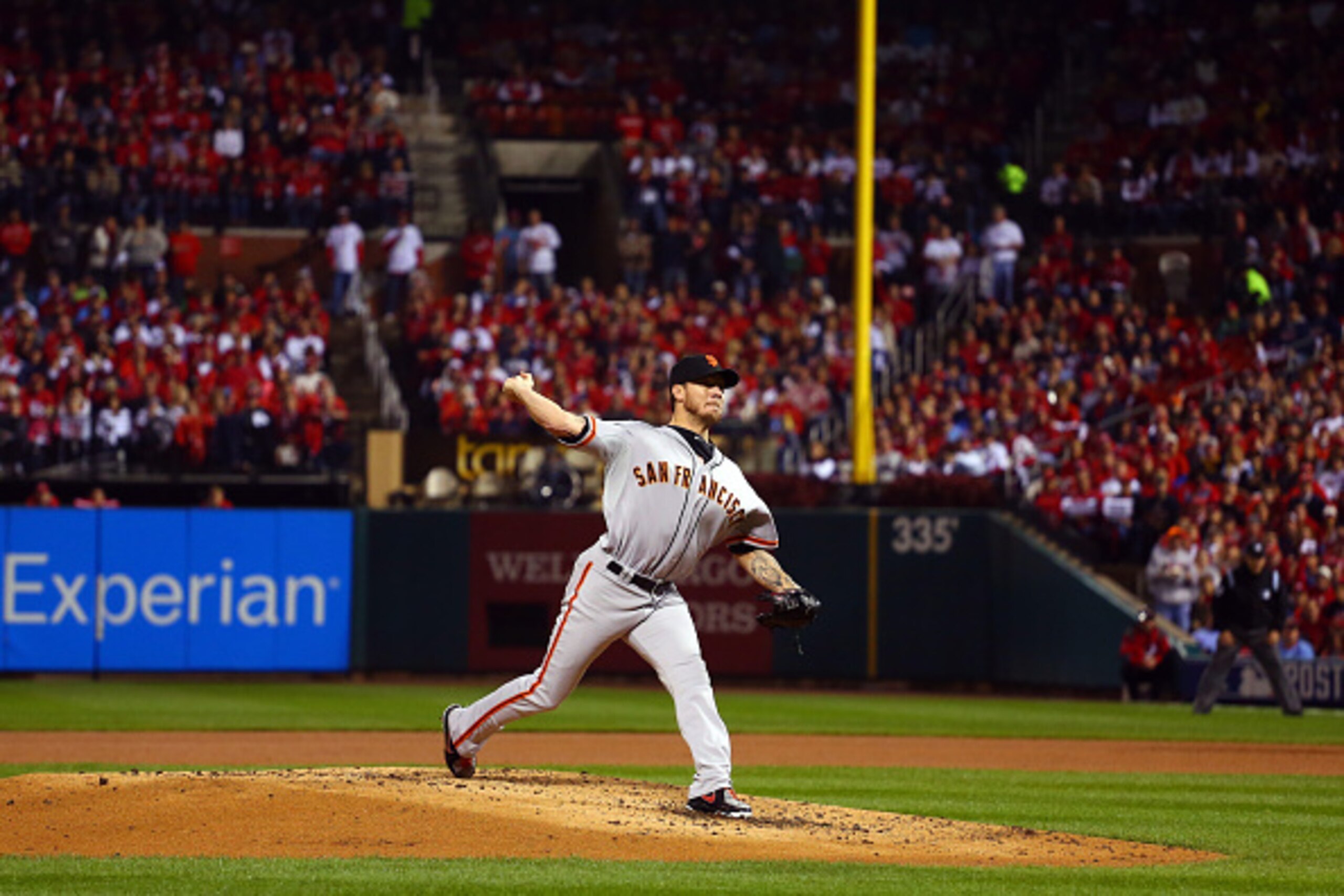 ST LOUIS, MO - OCTOBER 12:  Jake Peavy #22 of the San Francisco Giants pitches against the St. Louis Cardinals during Game Two of the National League Championship Series at Busch Stadium on October 12, 2014 in St Louis, Missouri.  (Photo by Dilip Vishwana