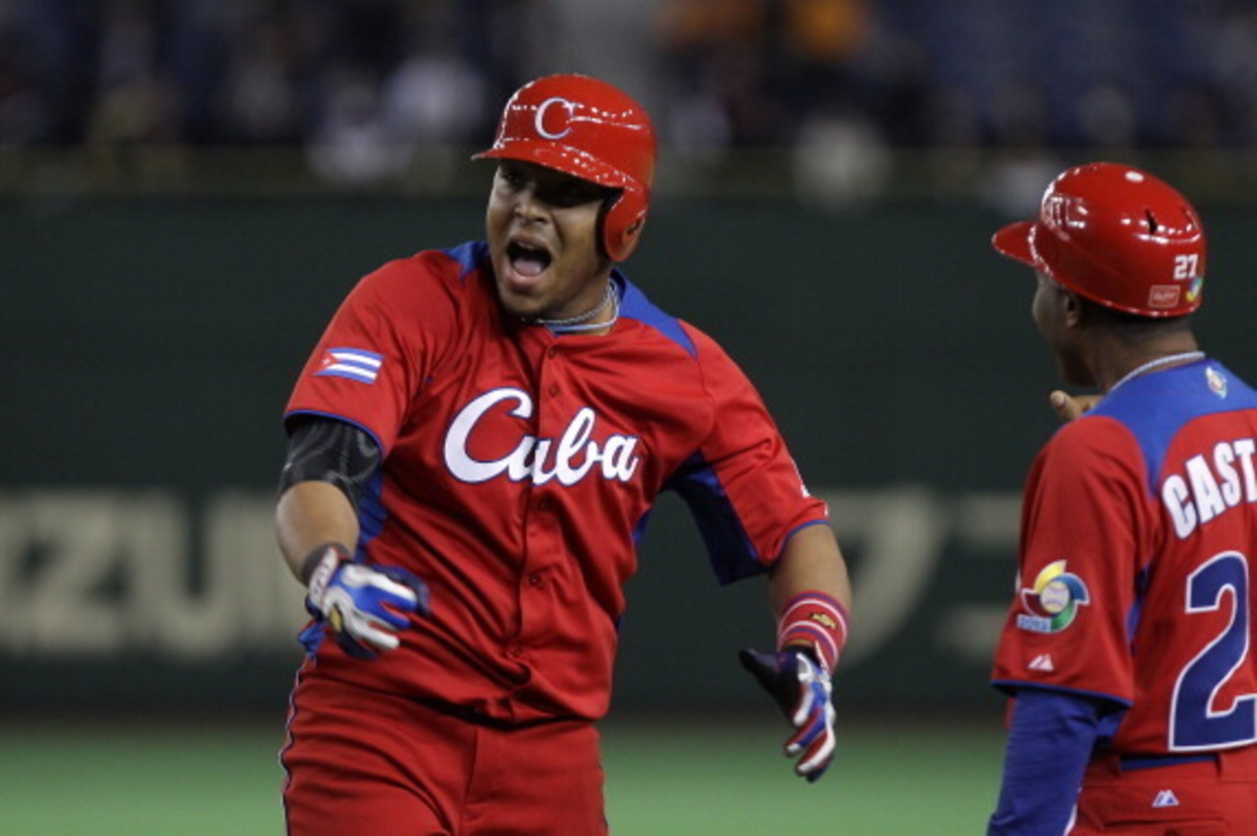 TOKYO, JAPAN - MARCH 11:  Outfielder Yasmany Tomas # 27 of Cuba reacts after hitting a RBI single in the eighth inning during the World Baseball Classic Second Round Pool 1 game between Cuba and the Netherlands at Tokyo Dome on March 11, 2013 in Tokyo, Ja