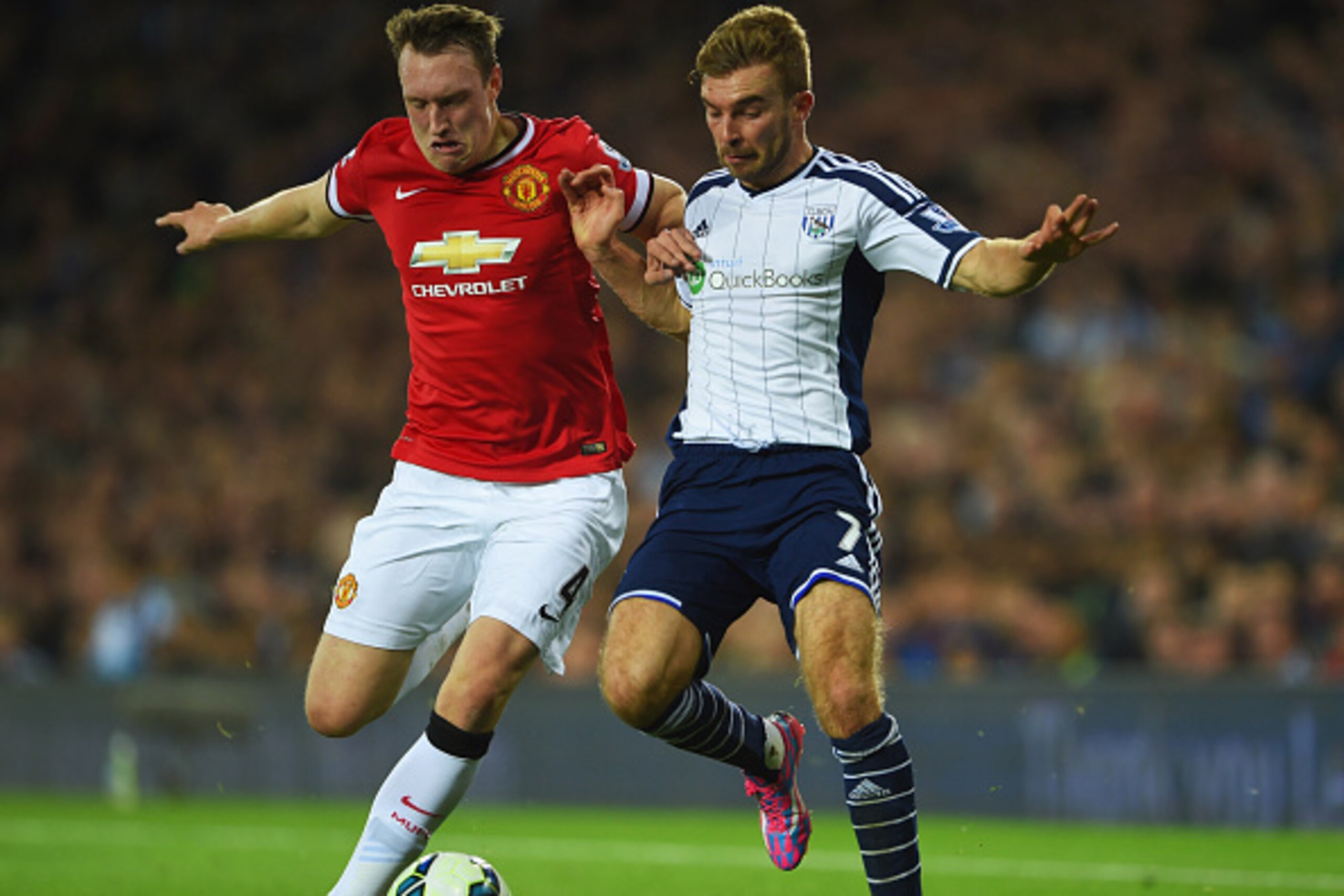 WEST BROMWICH, ENGLAND - OCTOBER 20:  Phil Jones of Manchester United tangles with James Morrison of West Bromwich Albion during the Barclays Premier League match between West Bromwich Albion and Manchester United at The Hawthorns on October 20, 2014 in W