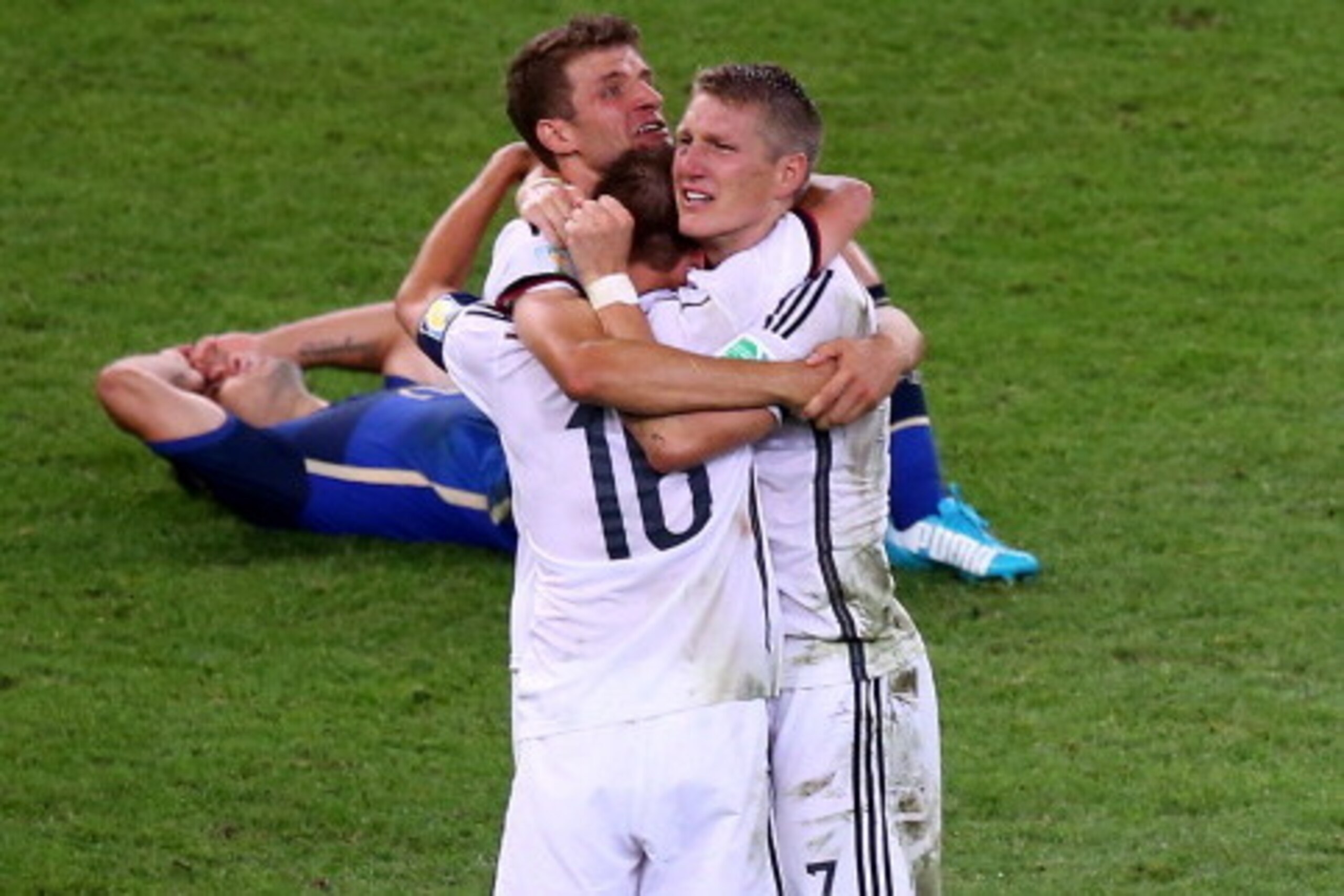 RIO DE JANEIRO, BRAZIL - JULY 13:  Mario Goetze of Germany celebrates with teammates after scoring his team's first goal in extra time during the 2014 FIFA World Cup Brazil Final match between Germany and Argentina at Maracana on July 13, 2014 in Rio de J