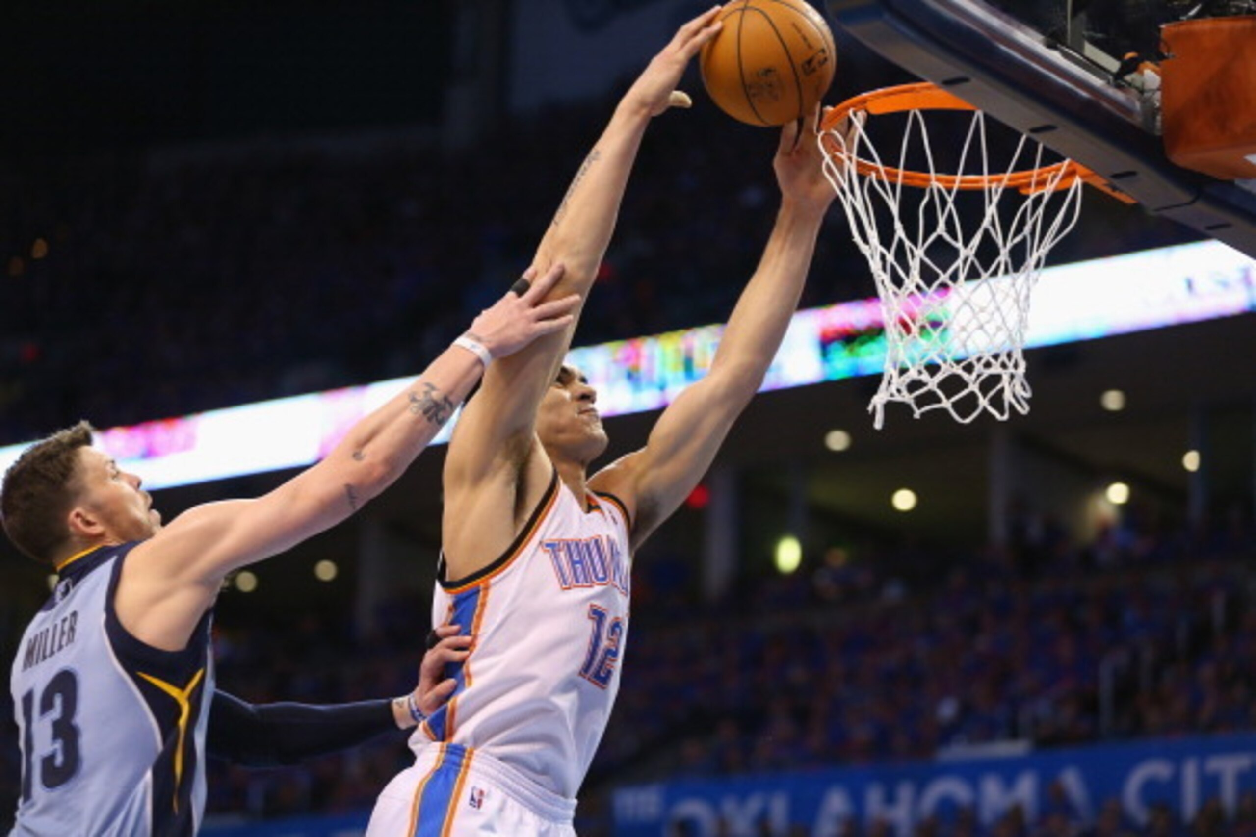 OKLAHOMA CITY, OK - MAY 03:   Steven Adams #12 of the Oklahoma City Thunder takes a shot against Mike Miller #13 of the Memphis Grizzlies in Game Seven of the Western Conference Quarterfinals during the 2014 NBA Playoffs at Chesapeake Energy Arena on May 