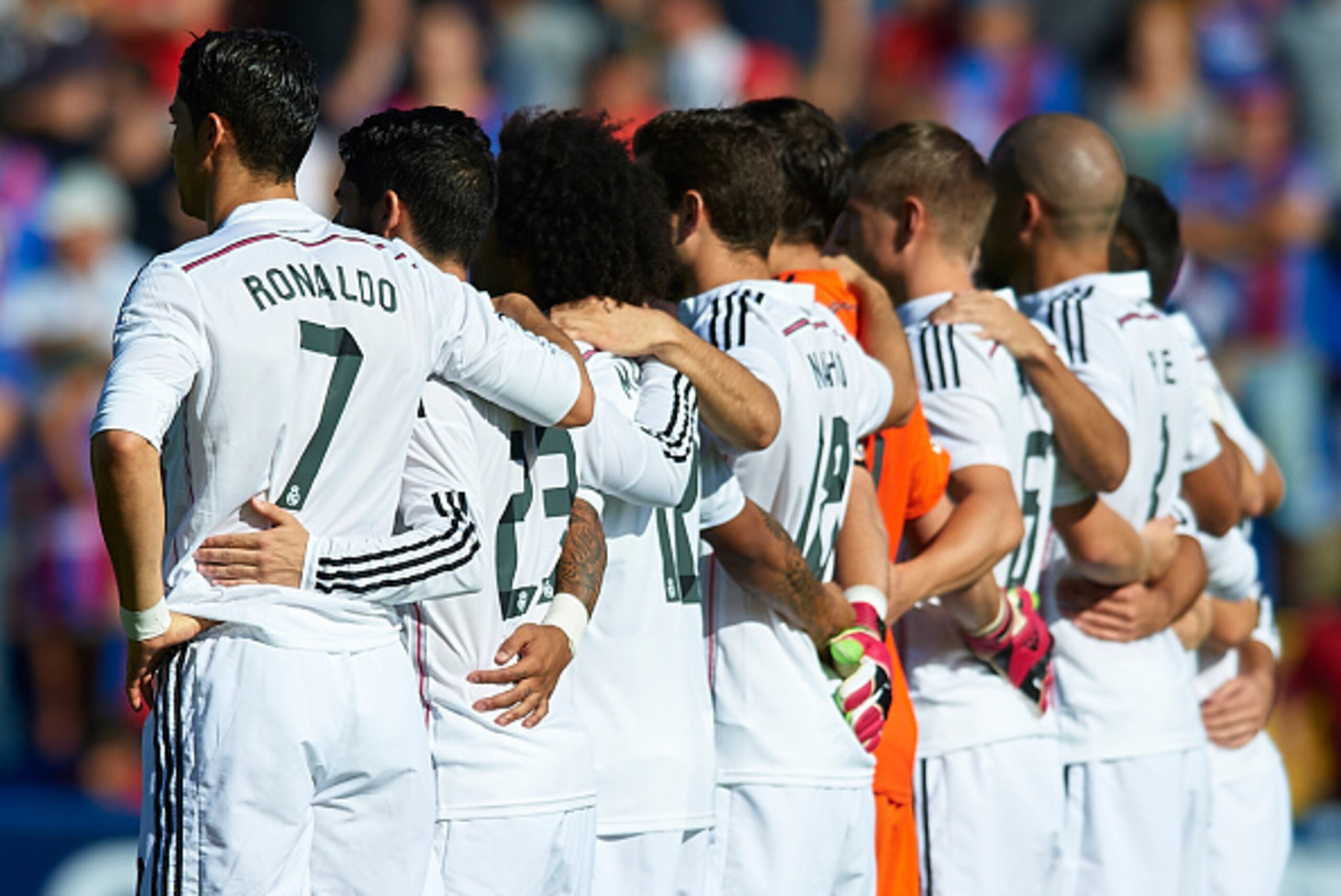 VALENCIA, SPAIN - OCTOBER 18:  Cristiano Ronaldo of Real Madrid embraces his teammates before the La Liga match between Levante UD and Real Madrid at Ciutat de Valencia on October 18, 2014 in Valencia, Spain.  (Photo by Manuel Queimadelos Alonso/Getty Ima