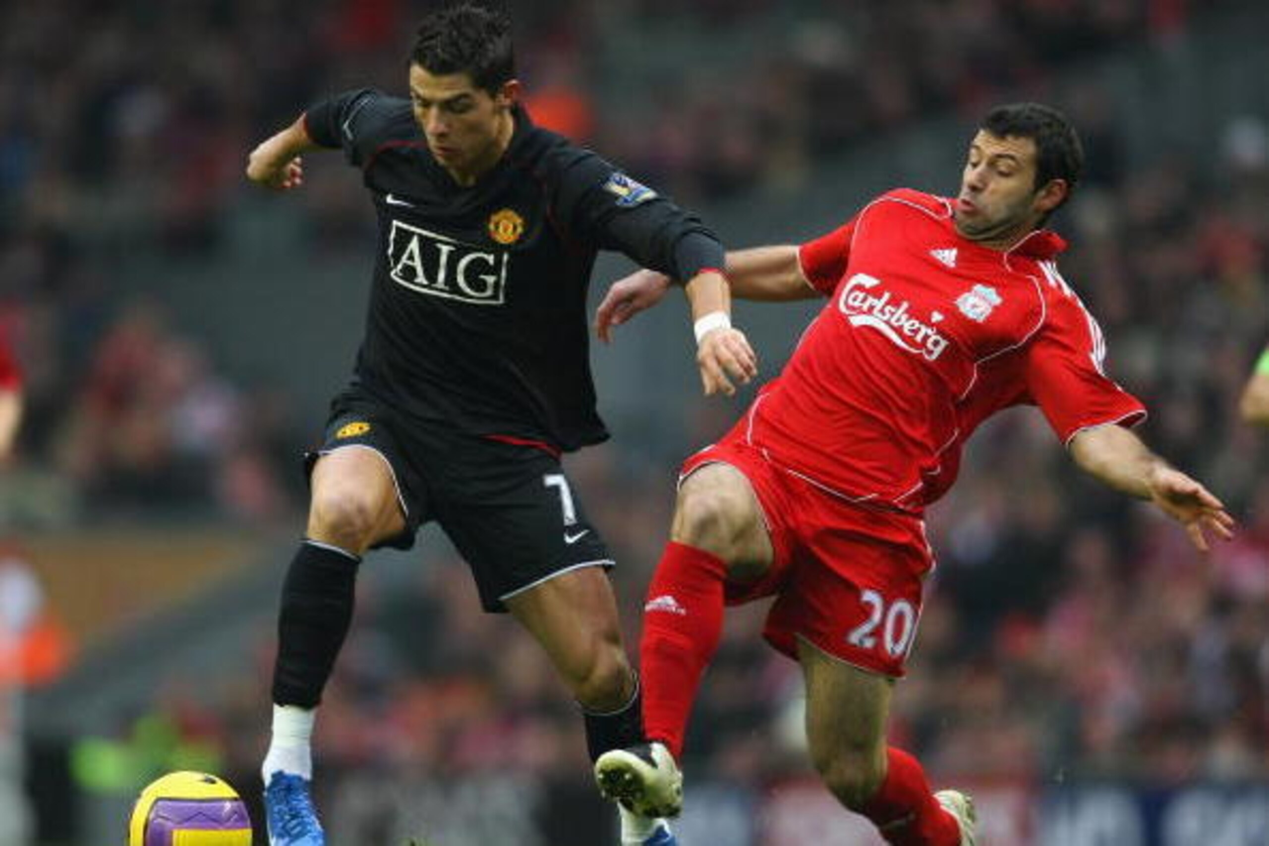 LIVERPOOL, UNITED KINGDOM - DECEMBER 16:  Cristiano Ronaldo of Manchester United is challenged by Javier Mascherano of Liverpool during the Barclays Premier League match between Liverpool and Manchester United at Anfield on December 16, 2007 in Liverpool,
