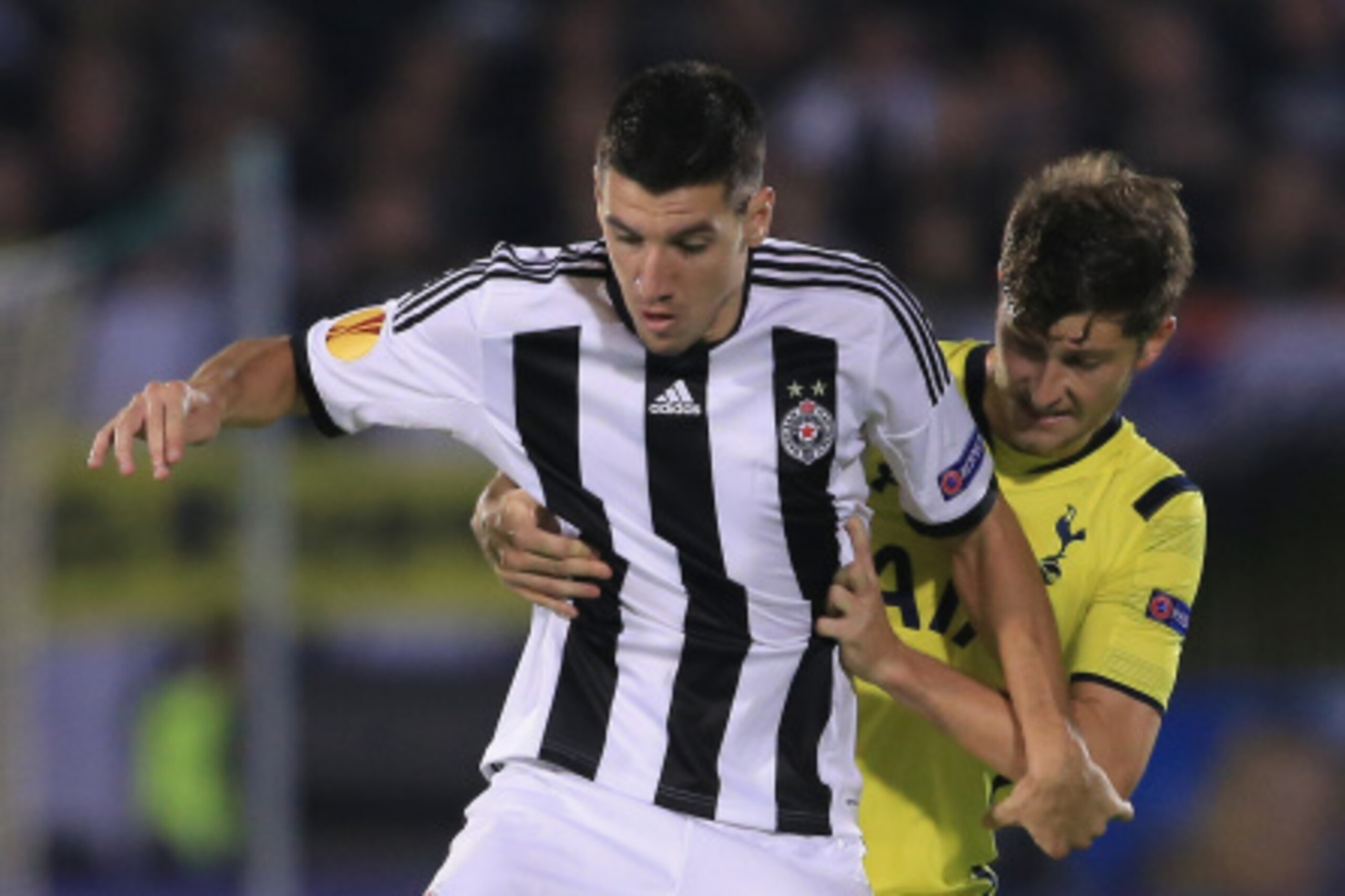 BELGRADE, SERBIA - SEPTEMBER 18:  Petar Grbic (L) of Partizan in action against Ben Davies (R) of Tottenham Hotspur during the UEFA Europa League match between Partizan and Tottenham Hotspur at the Stadium JNA on September 18, 2014 in Belgrade, Serbia, 20