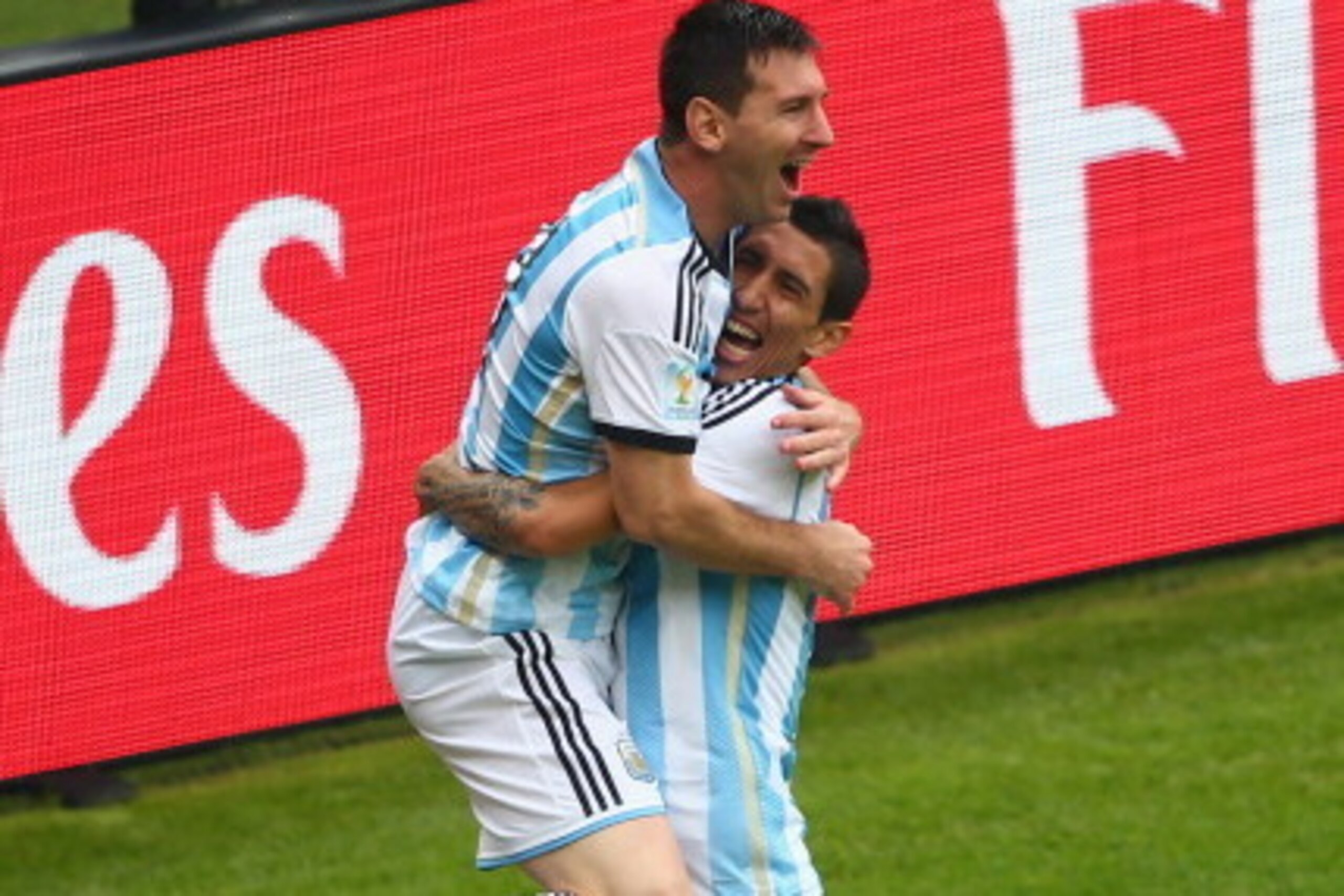 PORTO ALEGRE, BRAZIL - JUNE 25: Lionel Messi of Argentina (L) celebrates scoring his team's first goal with Angel di Maria during the 2014 FIFA World Cup Brazil Group F match between Nigeria and Argentina at Estadio Beira-Rio on June 25, 2014 in Porto Al PORTO ALEGRE, BRAZIL - JUNE 25: Lionel Messi of Argentina (L) celebrates scoring his team's first goal with Angel di Maria during the 2014 FIFA World Cup Brazil Group F match between Nigeria and Argentina at Estadio Beira-Rio on June 25, 2014 in Porto Al