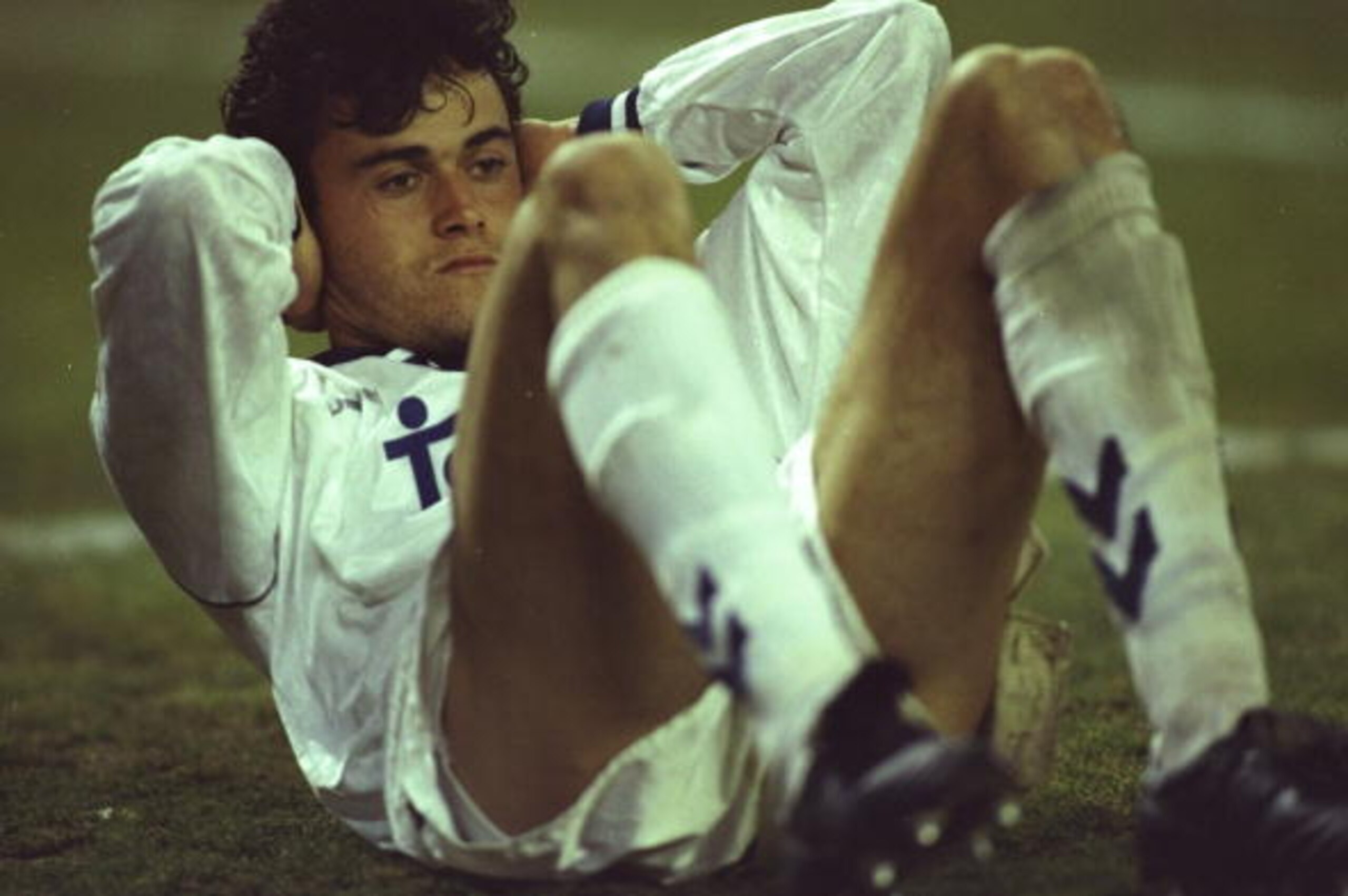 2 Mar 1993:  Luis Enrique Martinez of Real Madrid sits on the pitch during the UEFA Cup quarter-final First Leg match against Paris St Germain at the Santiago Bernabeu Stadium in Madrid, Spain. Real Madrid won the match 3-1. \ Mandatory Credit: Mike  Hewi