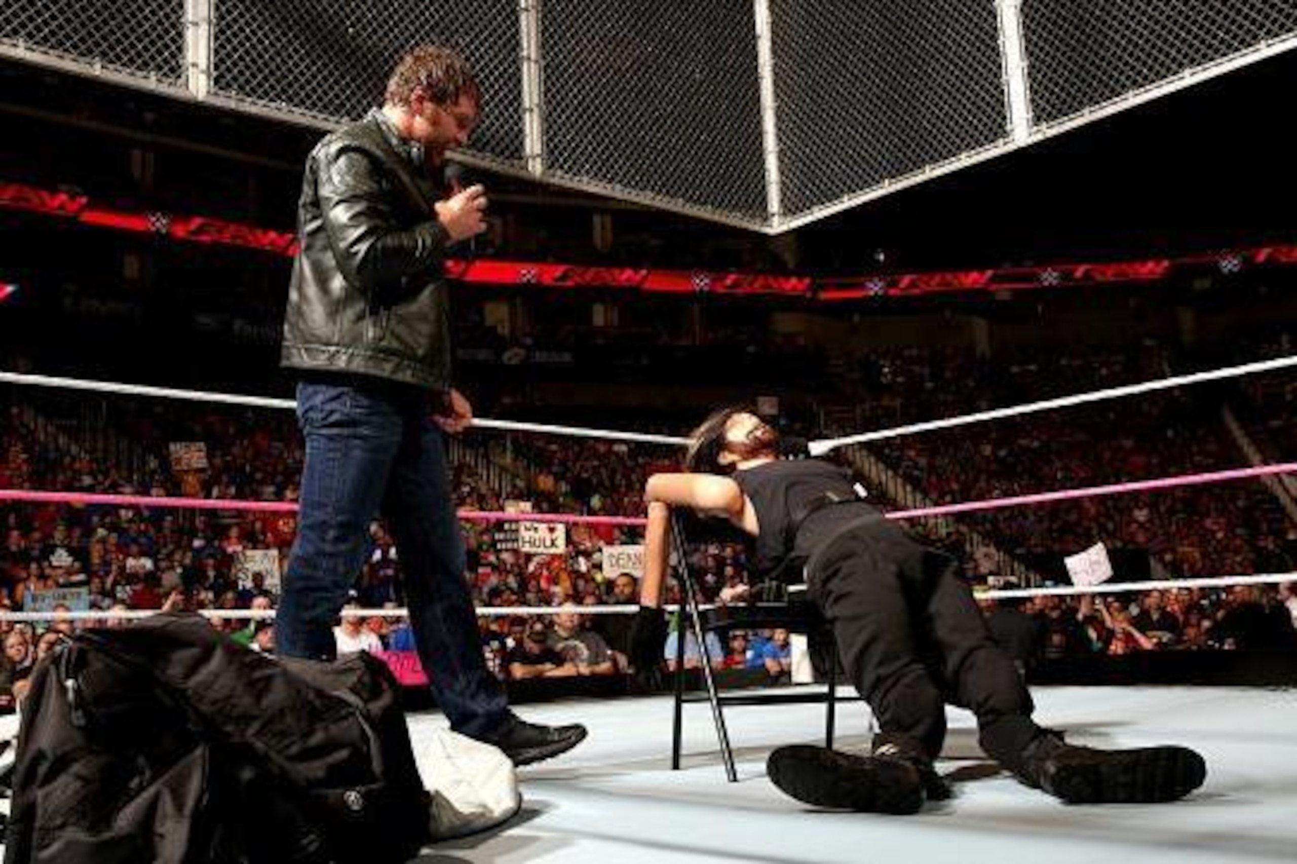 Dean Ambrose talks to a Seth Rollins dummy.