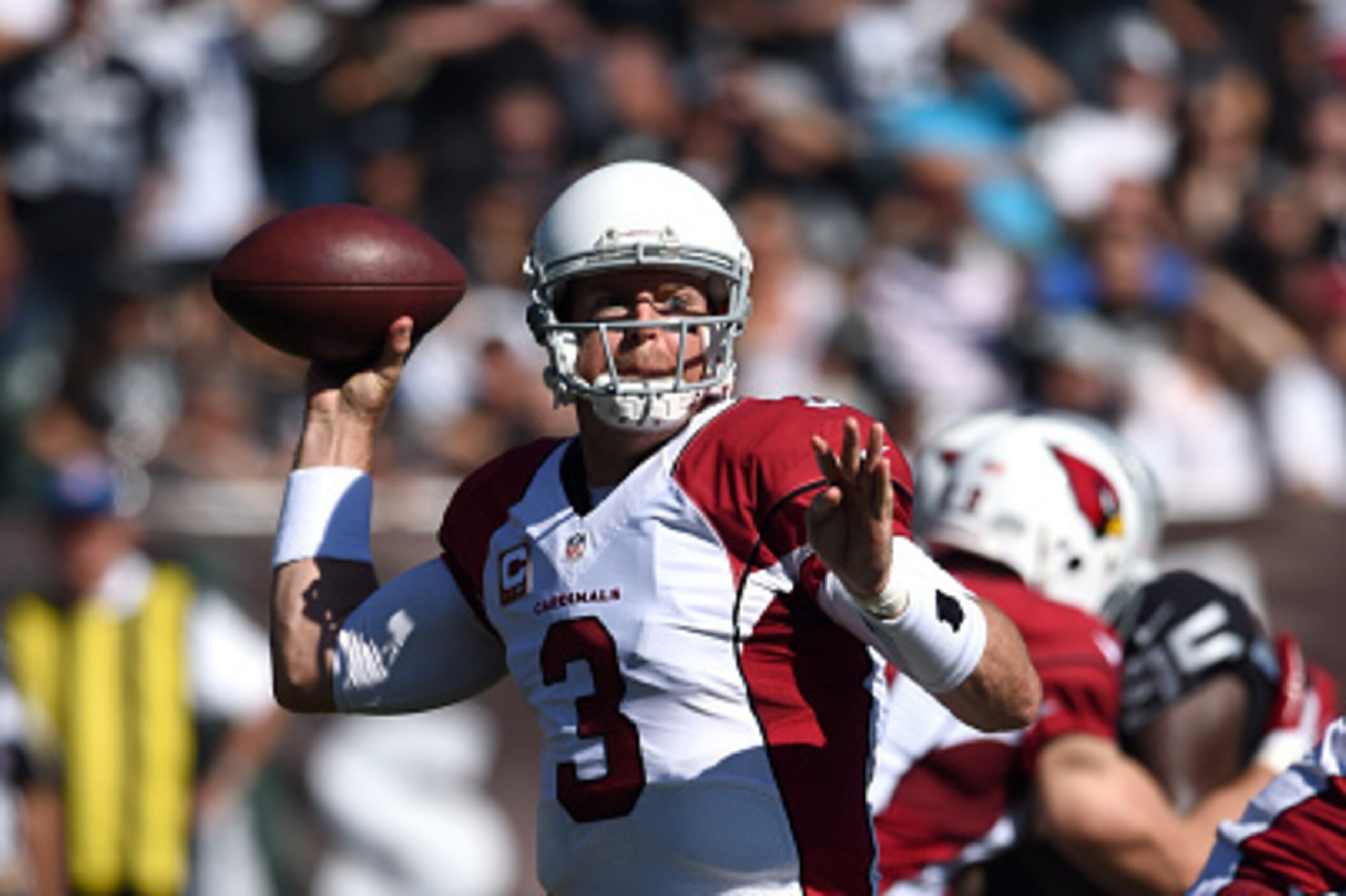 OAKLAND, CA - OCTOBER 19: Carson Palmer #3 of the Arizona Cardinals passes against the Oakland Raiders in the first half at O.co Coliseum on October 19, 2014 in Oakland, California. (Photo by Thearon W. Henderson/Getty Images) OAKLAND, CA - OCTOBER 19: Carson Palmer #3 of the Arizona Cardinals passes against the Oakland Raiders in the first half at O.co Coliseum on October 19, 2014 in Oakland, California. (Photo by Thearon W. Henderson/Getty Images)