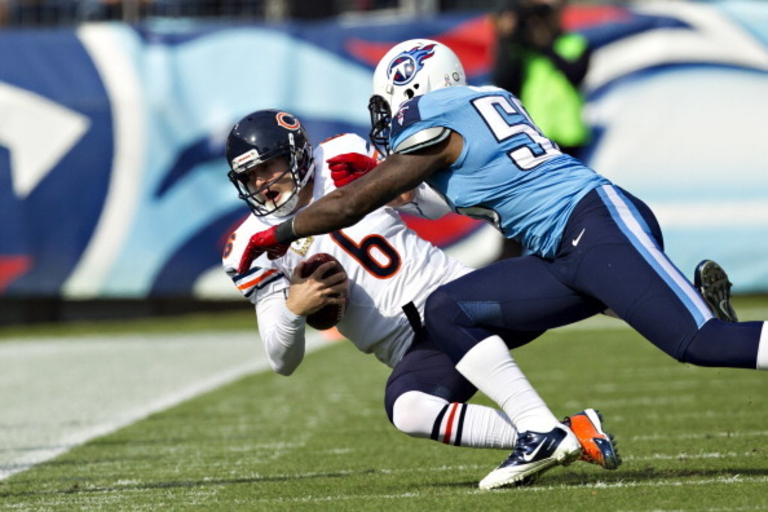 NASHVILLE, TN - NOVEMBER 4:  Jay Cutler #6 of the Chicago Bears is tackled by Akeem Ayers #56 of the Tennessee Titans at LP Field on November 4, 2012 in Nashville, Tennessee.  (Photo by Wesley Hitt/Getty Images)