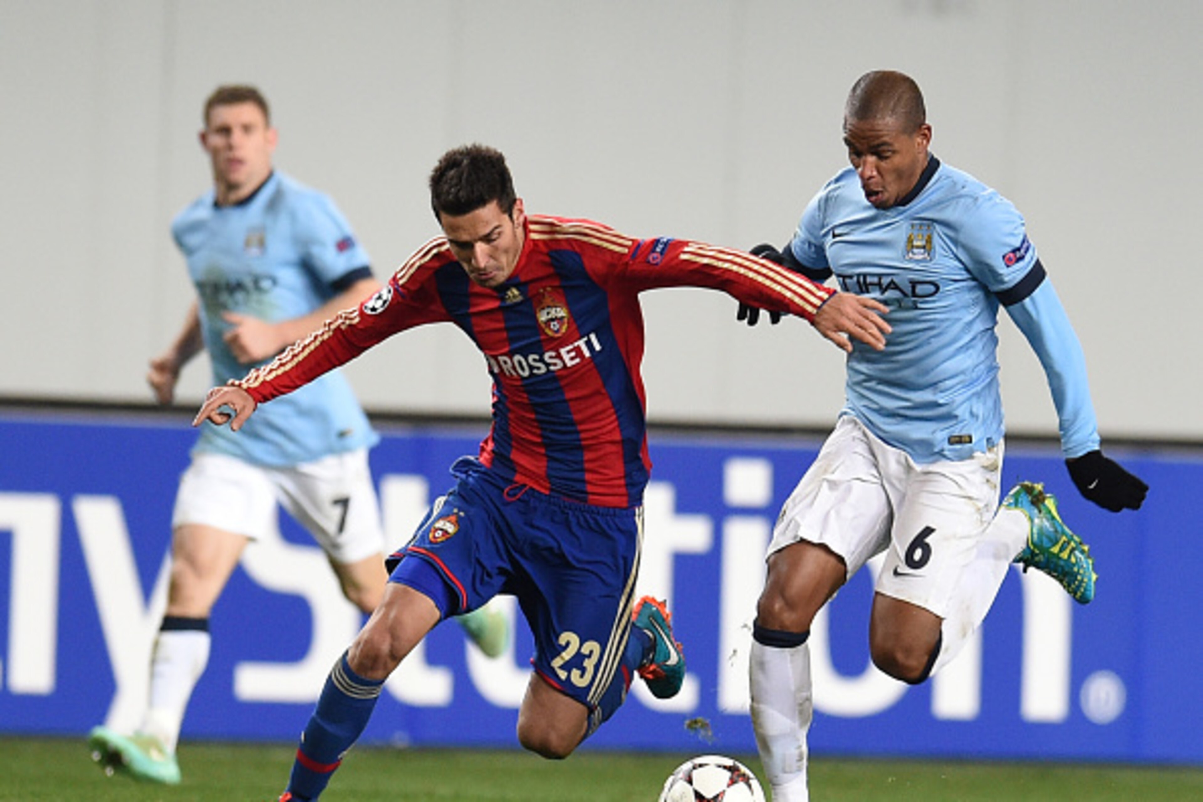 KHIMKI, RUSSIA - OCTOBER 21: Georgi Milanov (L) of PFC CSKA Moscow challenged by Fernando of Manchester City FC during the UEFA Champions League Group E match between PFC CSKA Moscow and Manchester City FC at the Arena Khimki Stadium on October 21, 2014 i