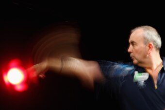 SYDNEY, AUSTRALIA - AUGUST 29:  Phil Taylor of England competes in his quarter-final match against Dave Chisnall of England during the Sydney Darts Masters at Hordern Pavilion on August 29, 2014 in Sydney, Australia.  (Photo by Mark Kolbe/Getty Images)