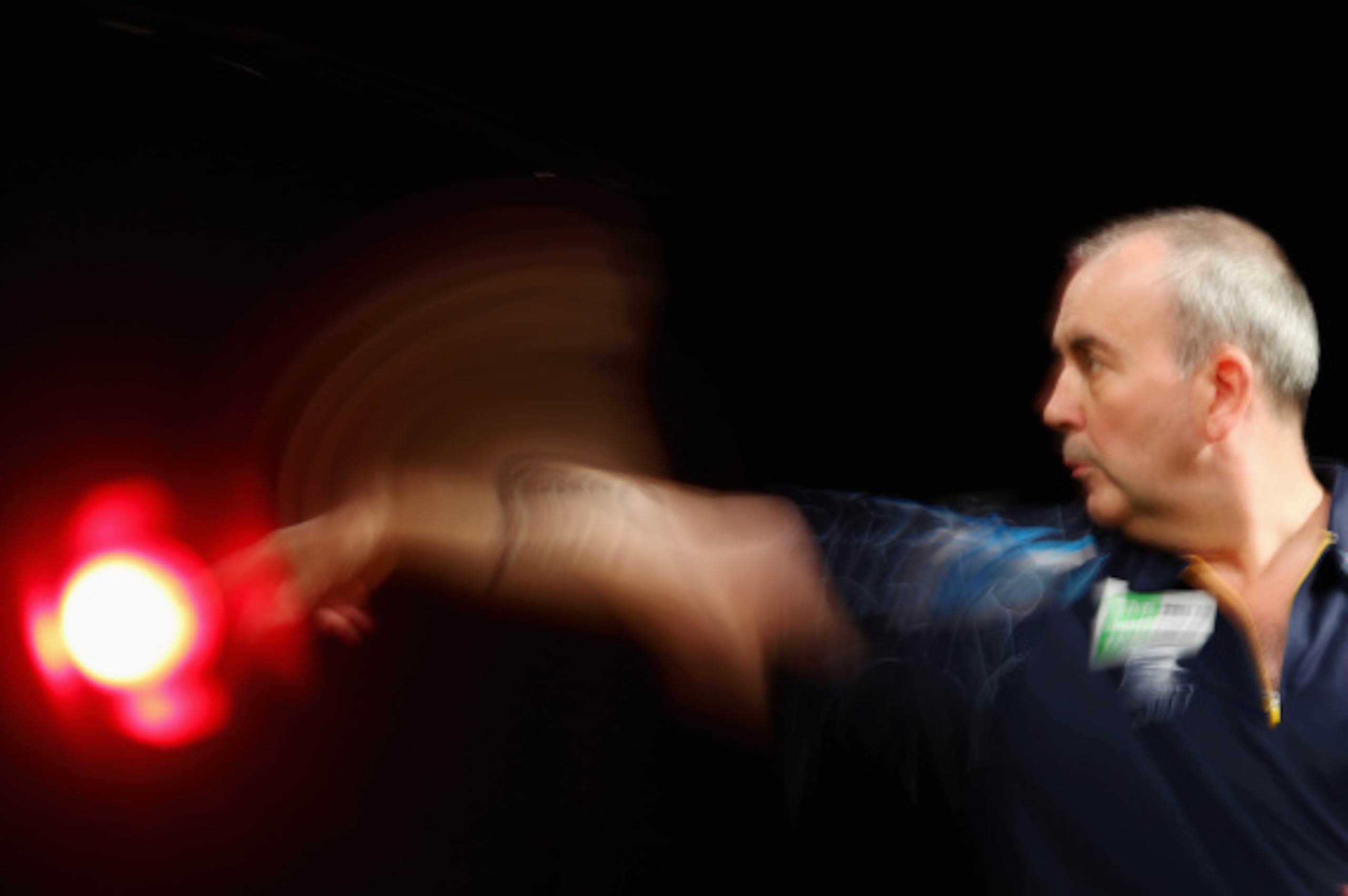 SYDNEY, AUSTRALIA - AUGUST 29:  Phil Taylor of England competes in his quarter-final match against Dave Chisnall of England during the Sydney Darts Masters at Hordern Pavilion on August 29, 2014 in Sydney, Australia.  (Photo by Mark Kolbe/Getty Images)