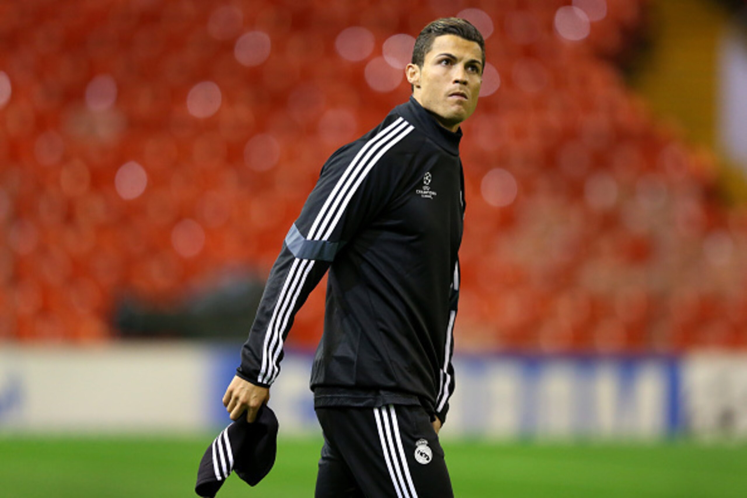 LIVERPOOL, ENGLAND - OCTOBER 21:  Cristiano Ronaldo of Real Madrid CF looks around Anfield as he walks out for a training session at Anfield on October 21, 2014 in Liverpool, United Kingdom.  (Photo by Alex Livesey/Getty Images)
